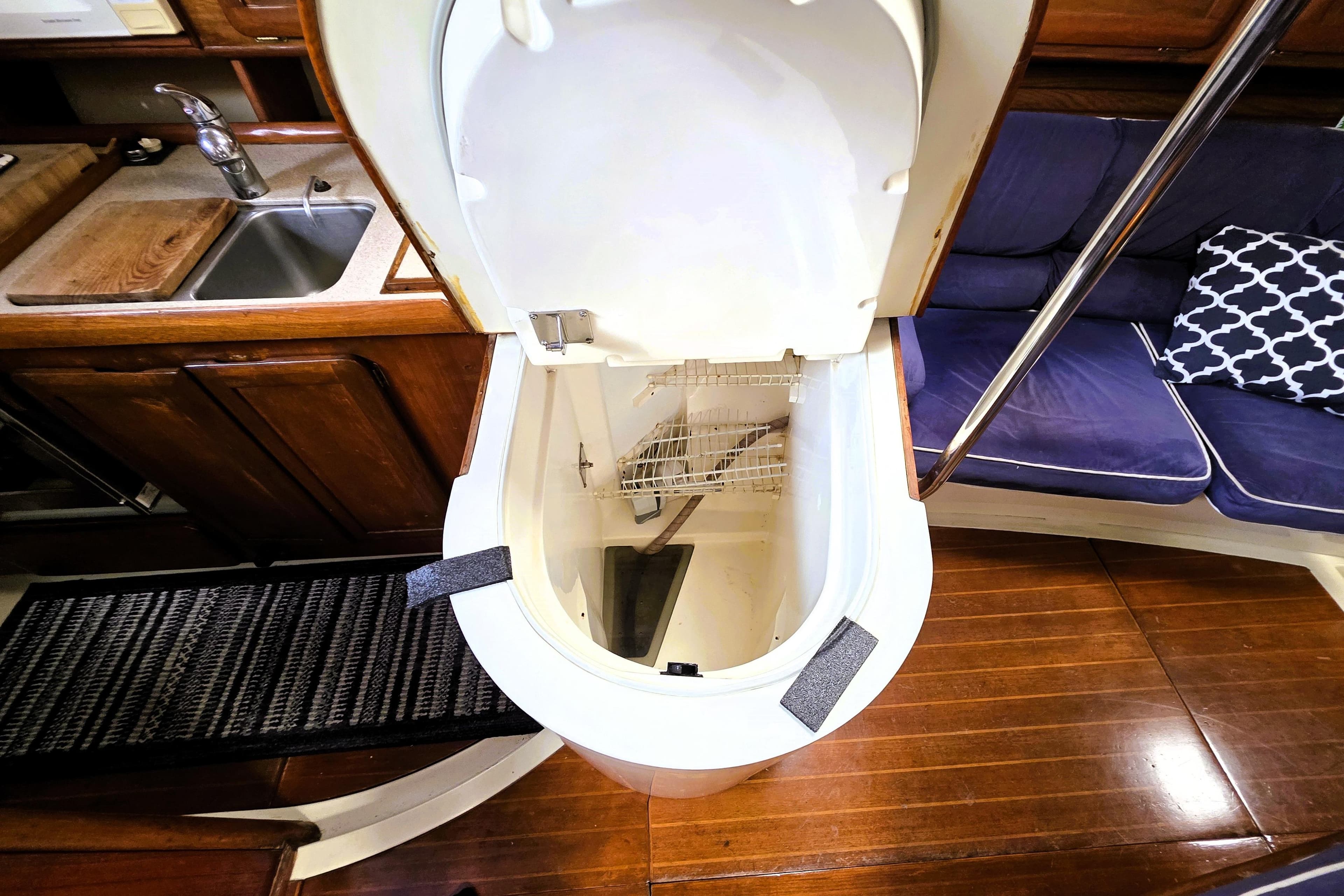 Interior of 1992 Hunter 43 Legend yacht, featuring a compact kitchen and seating area.