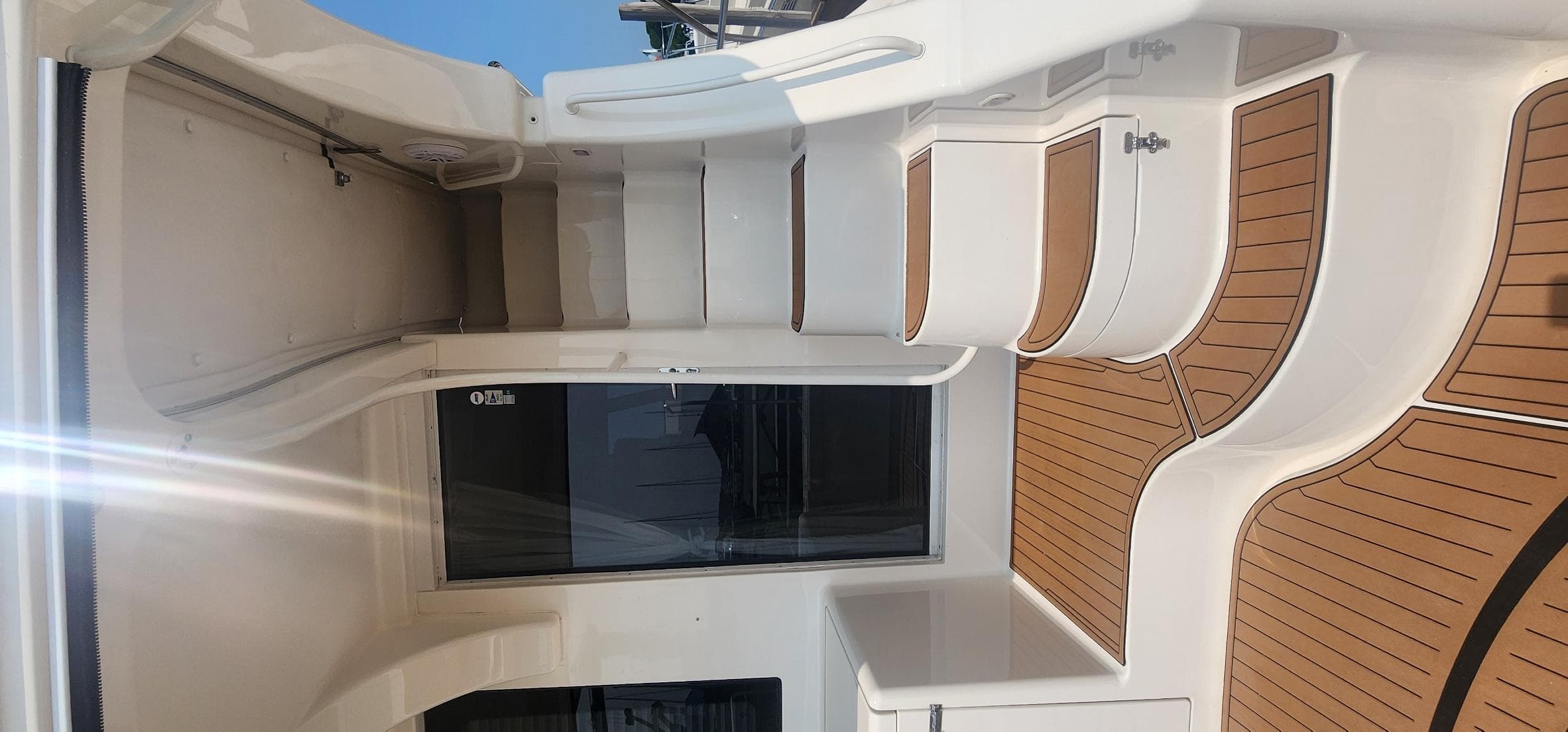 2004 Silverton 48 Convertible yacht interior with sleek white and wood design.