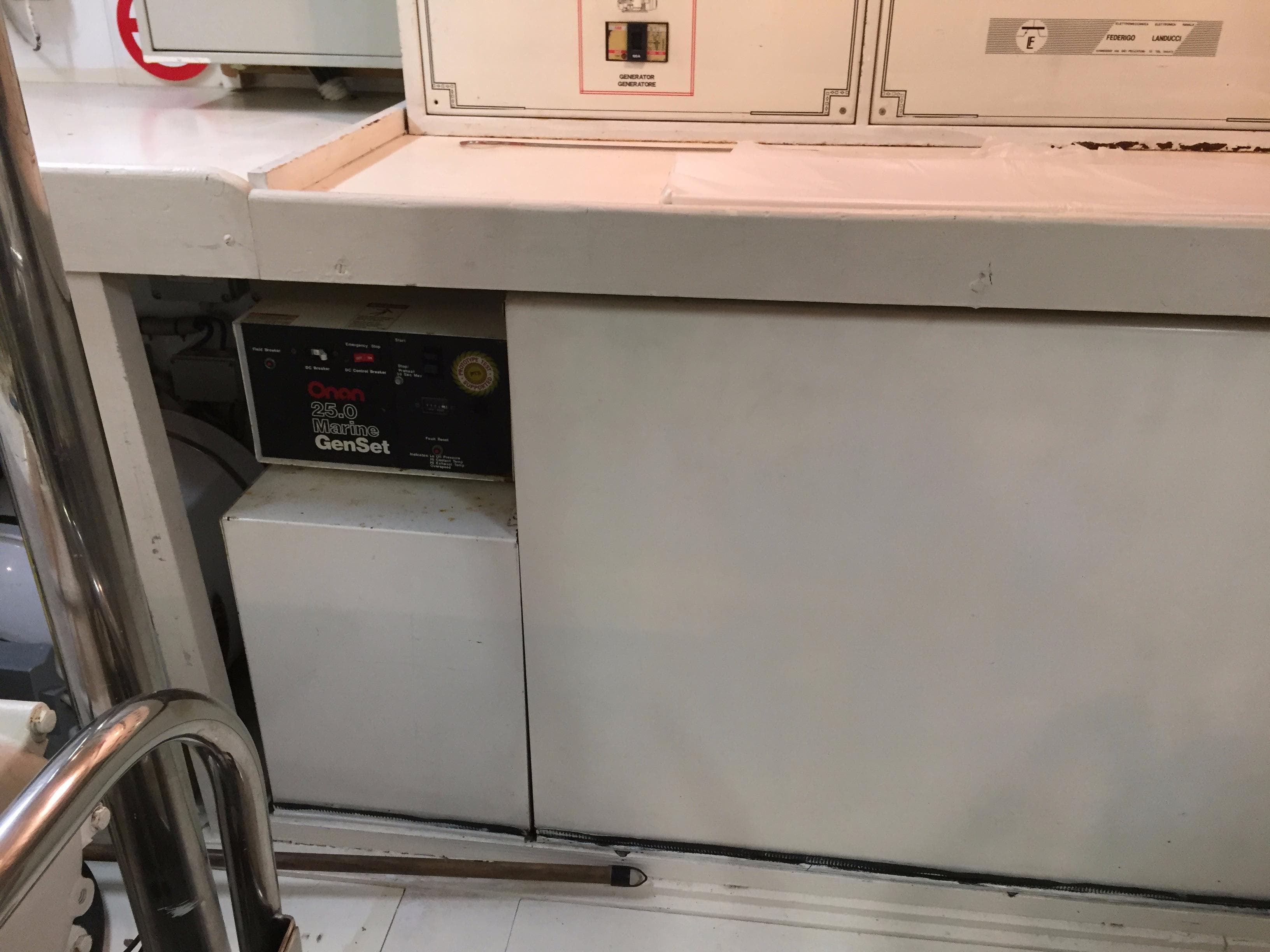 Generator compartment in a 1994 Falcon 76 yacht, featuring a GenSet unit.