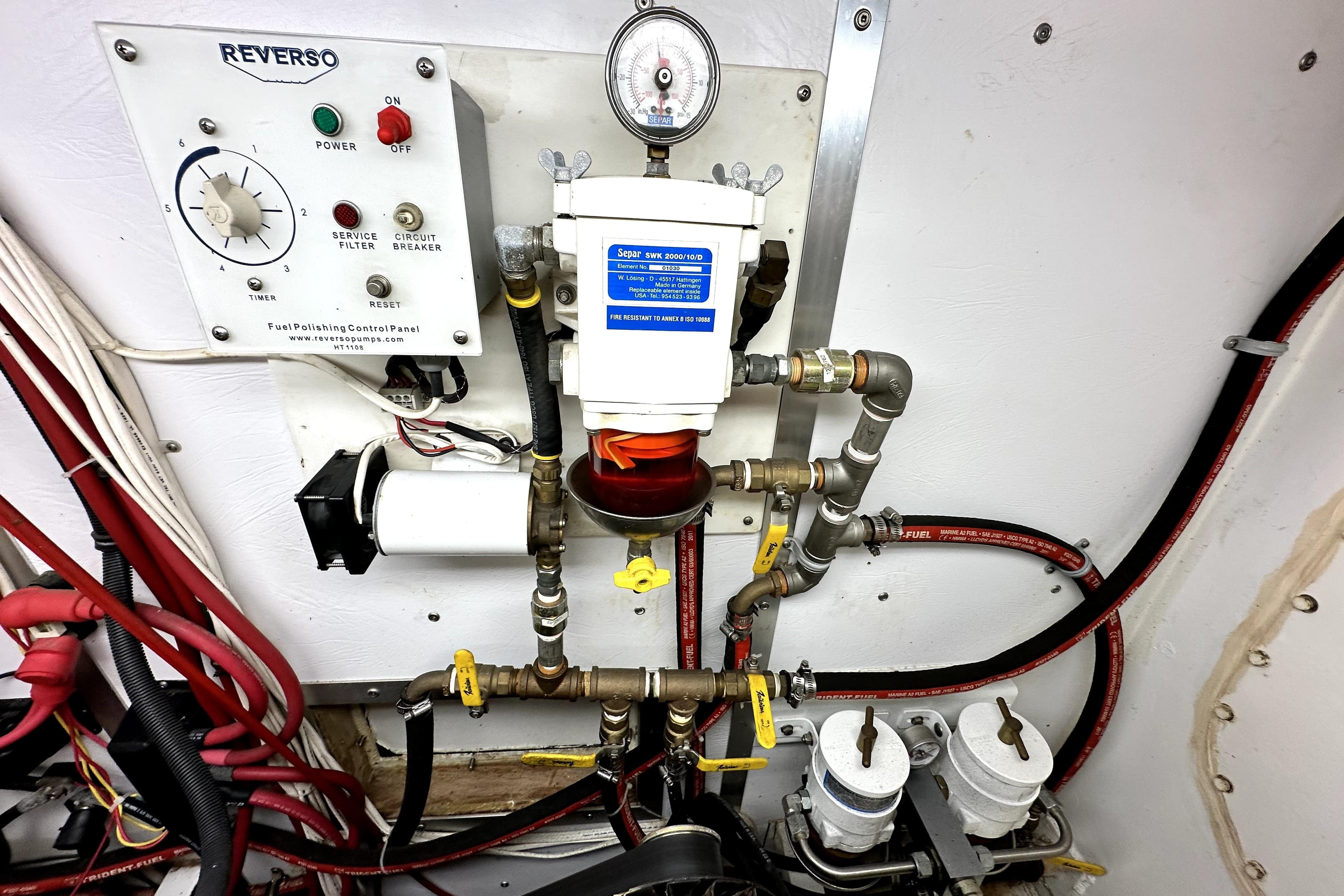 Engine room of a 2012 Custom Pacific Northwest 43 with fuel polishing system.