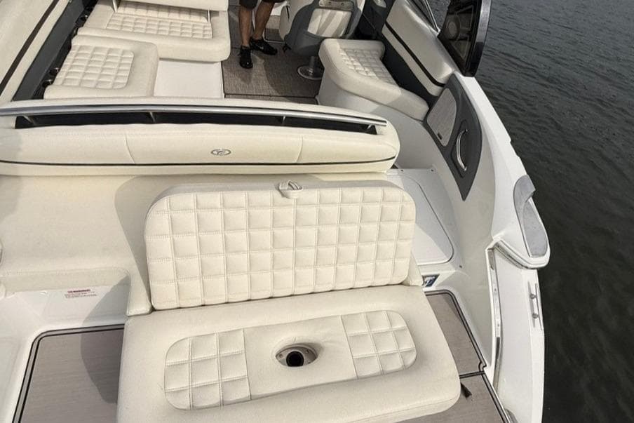 2018 Cobalt R5 WSS Surf boat interior with white cushioned seating.