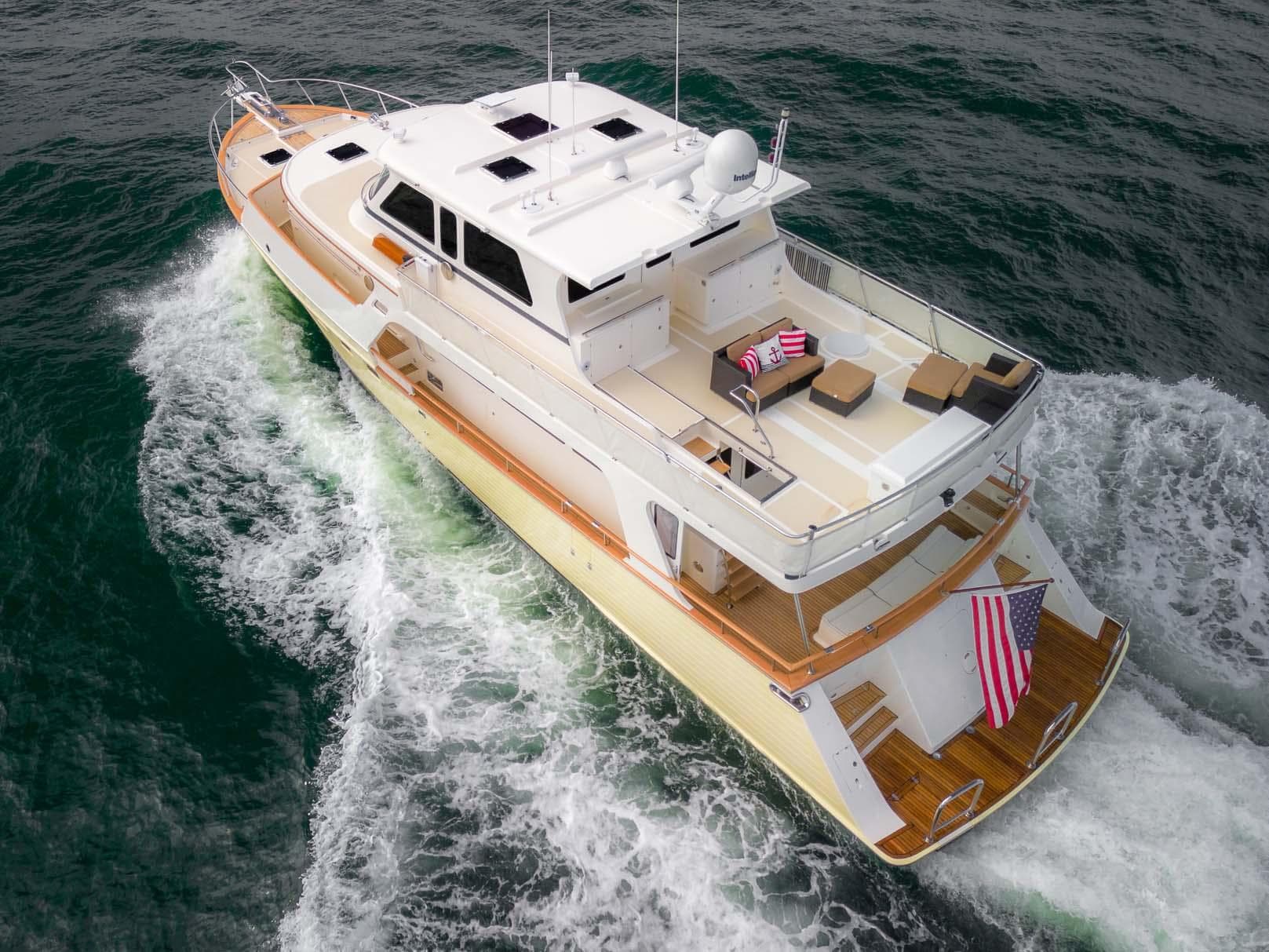 Luxury 2006 Marlow 72E LRC yacht cruising on open water.