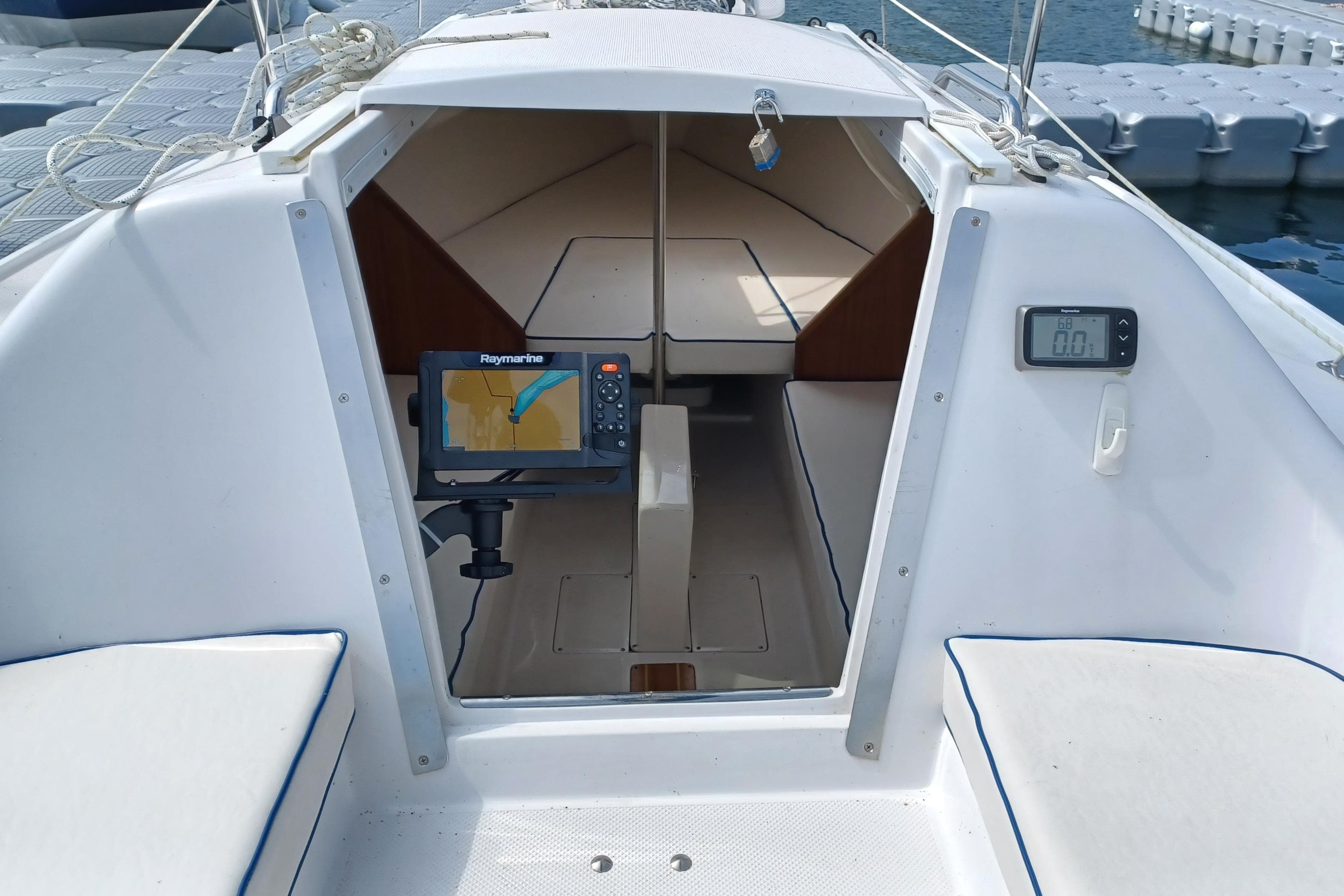 2023 Catalina 22 Sport sailboat cockpit with navigation equipment and seating.