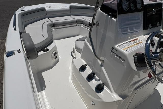 2021 NauticStar 211 Hybrid boat interior with seating and control console.