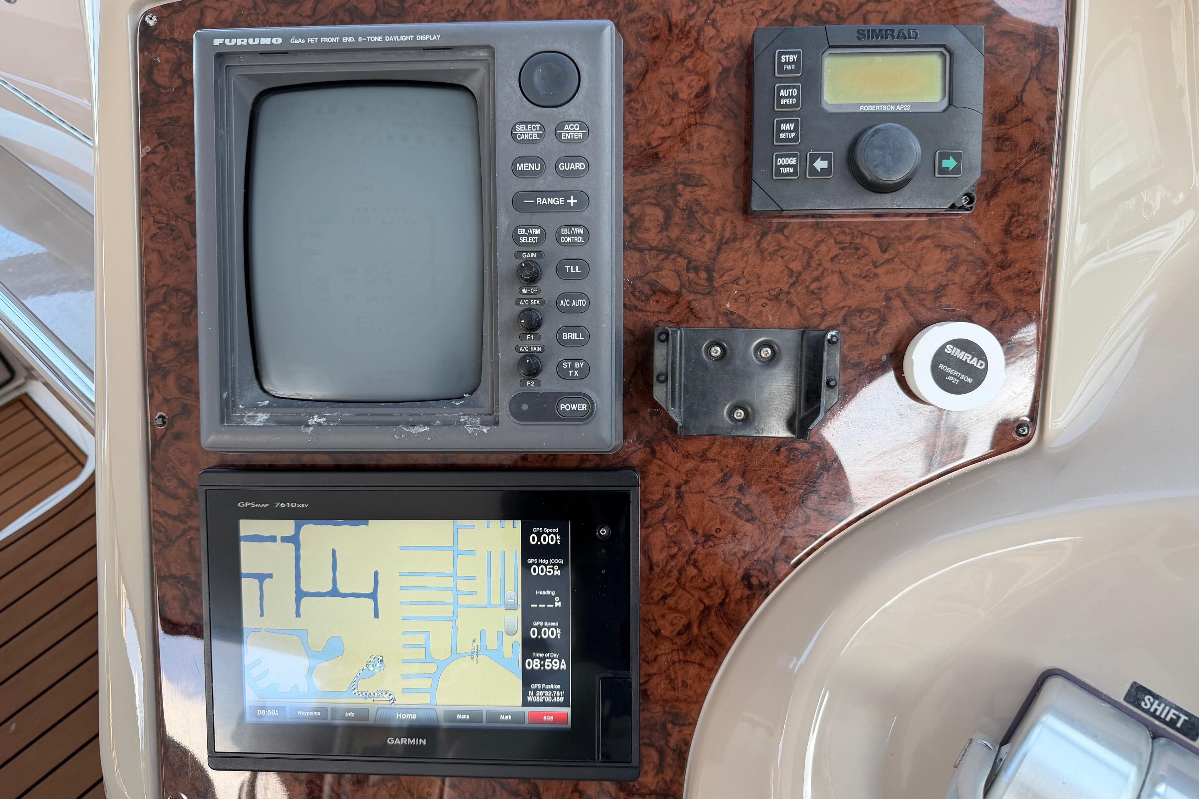 Control panel of a 2001 Sea Ray Sundancer 510 with navigation equipment.