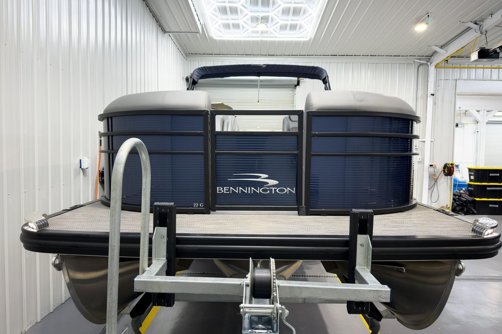 2020 Bennington G 23 GL pontoon boat in a well-lit garage.
