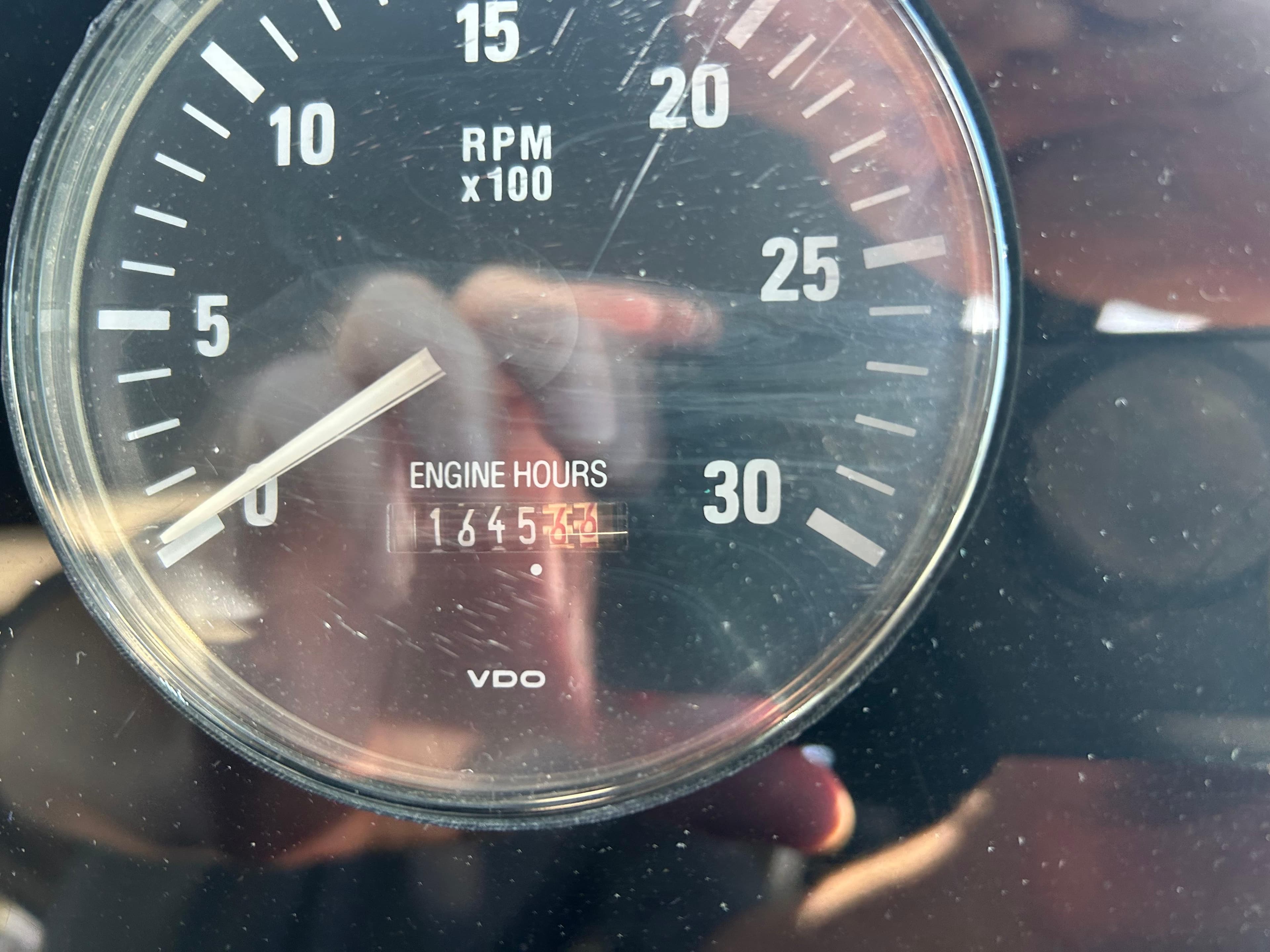 Close-up of Tiara Yachts 3500 Express 1998 tachometer showing 1645 engine hours.