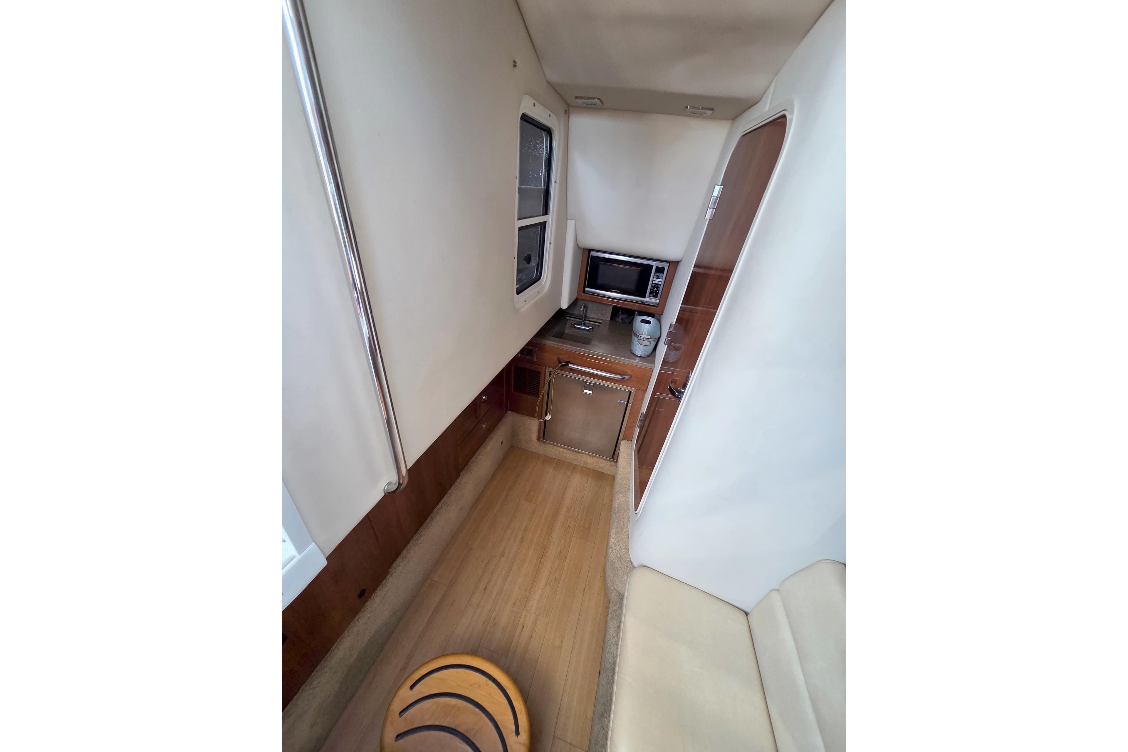2015 Formula 350 Crossover Bowrider interior with kitchenette and seating area.