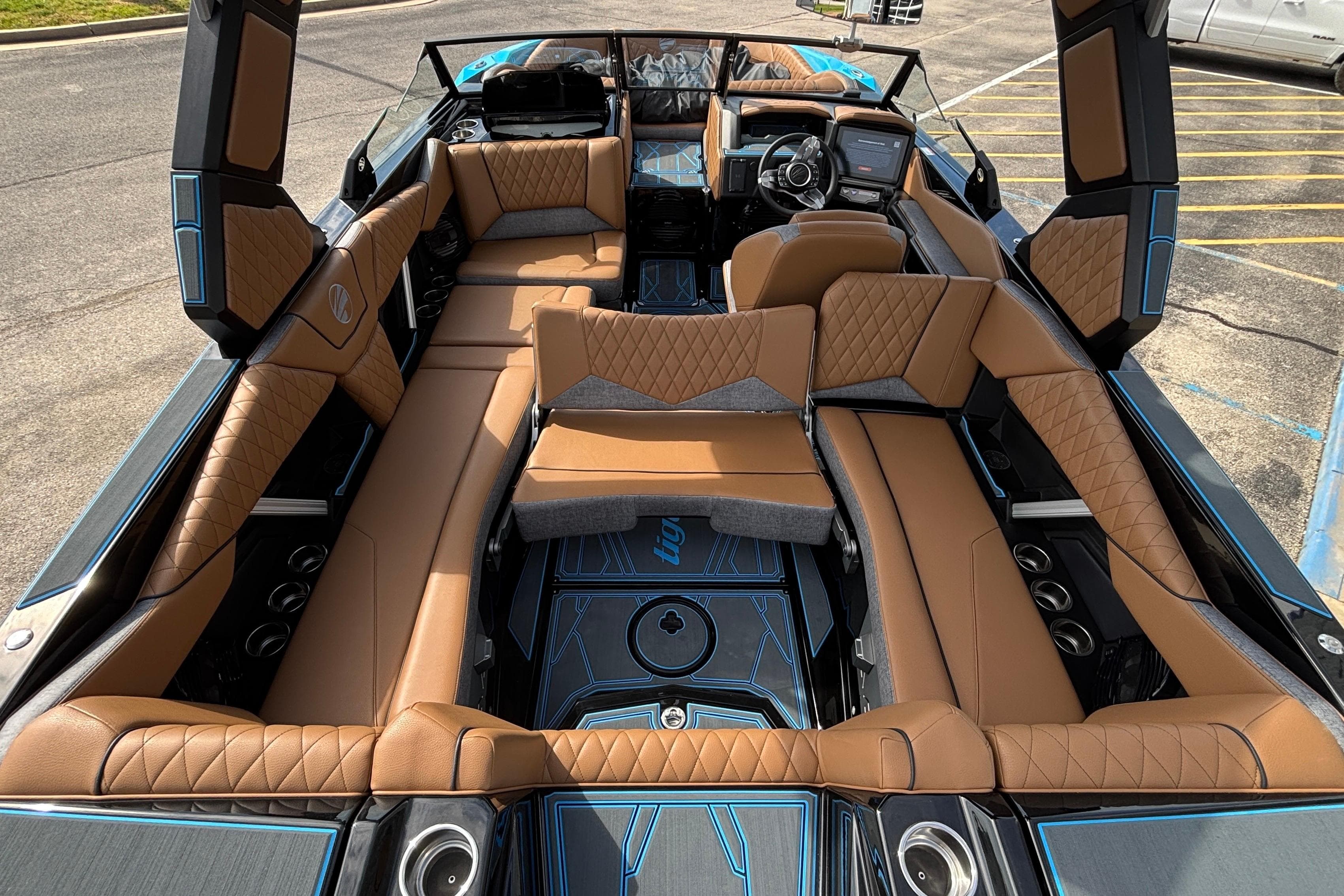2026 Tigé Z3 boat interior with luxurious brown leather seating and modern dashboard.