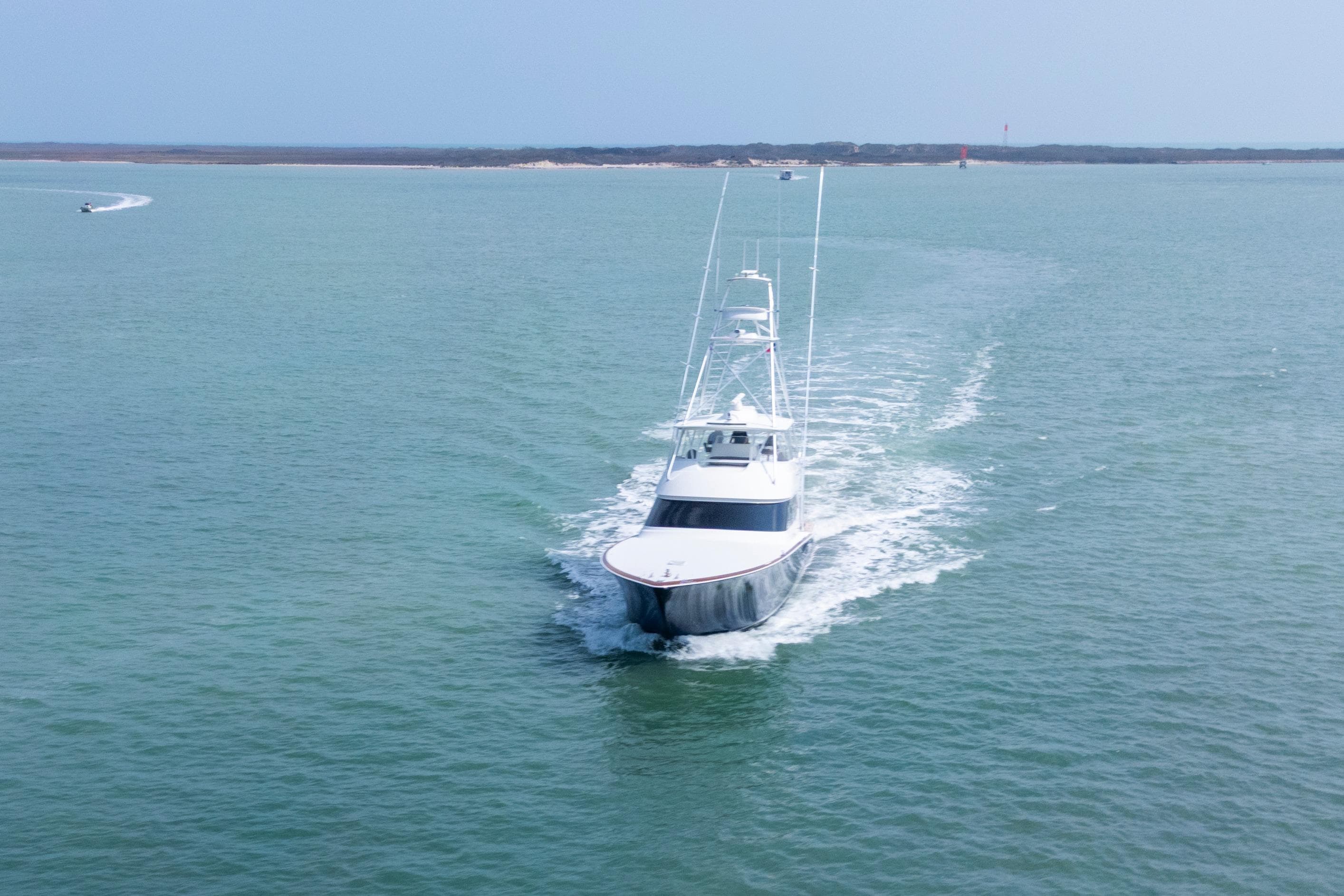 2011 Viking 70 Convertible yacht cruising on open water.