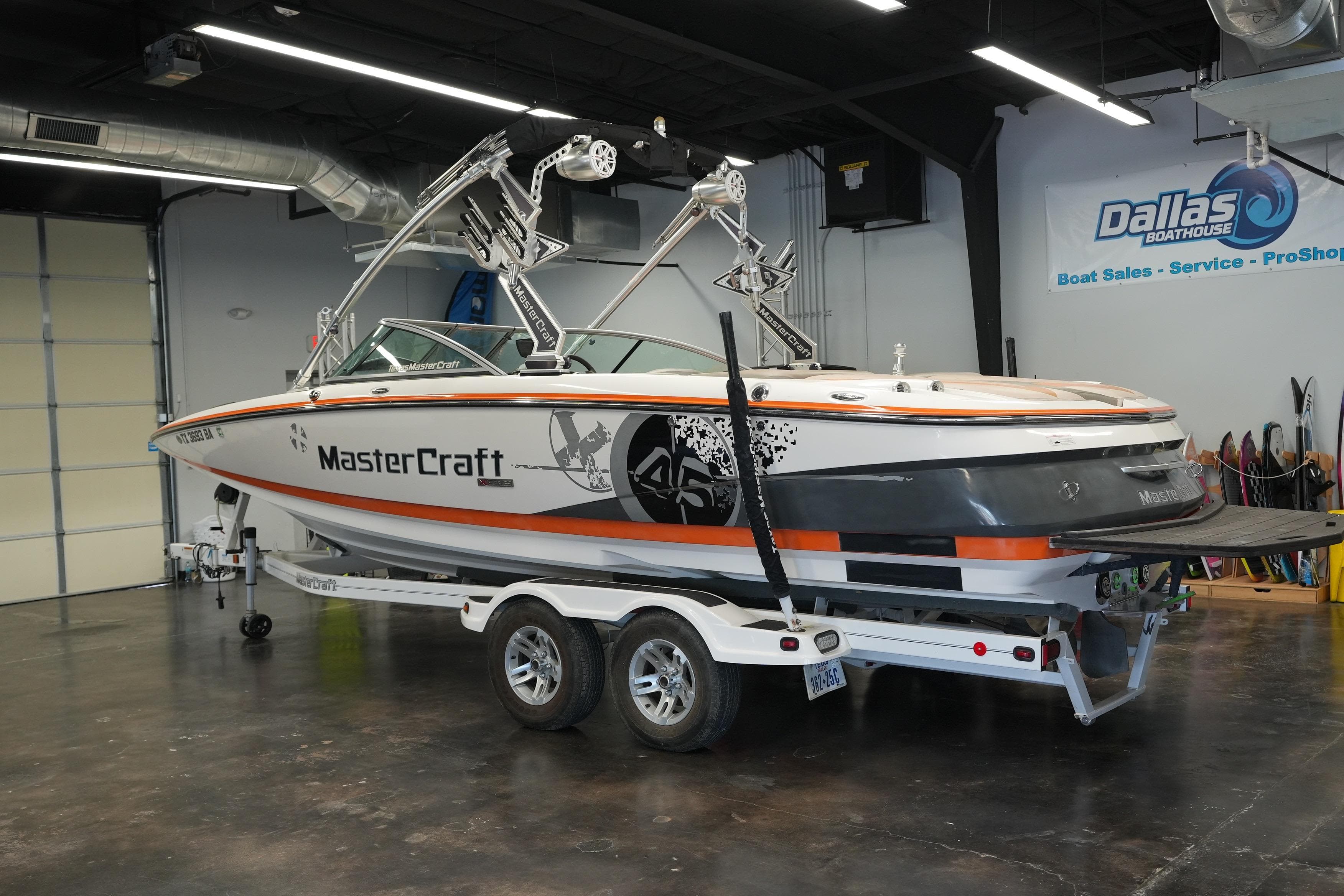 2009 MasterCraft X-45 boat on trailer in showroom, Dallas Boathouse.