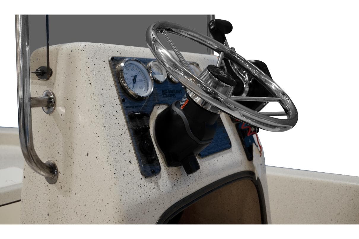 Manufacturer Provided Image: 2025 Carolina Skiff E18 JVX CC boat console with steering wheel and gauges.