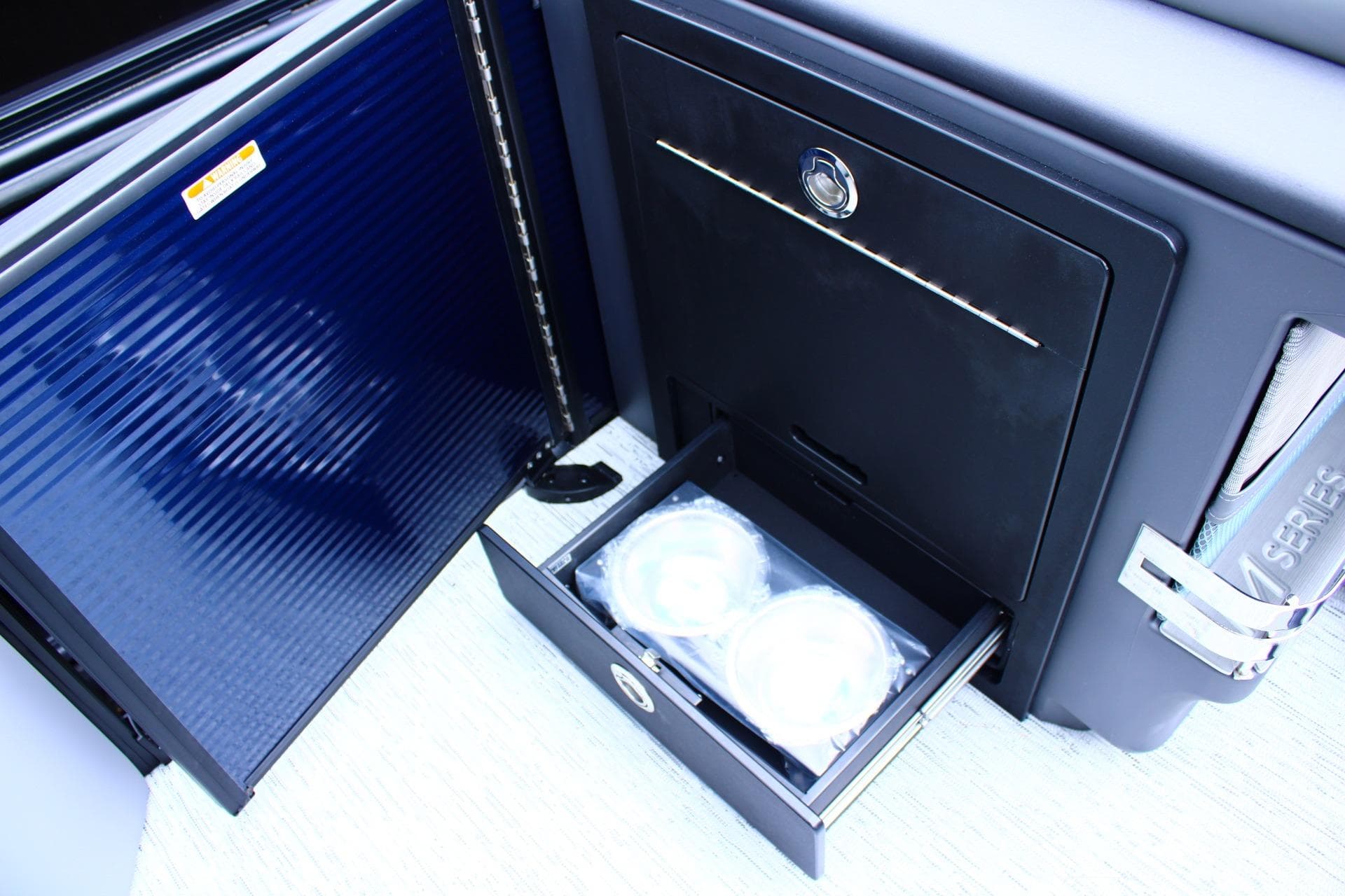 2026 Bennington 24 MFBSF boat interior storage compartments and drawer detail.
