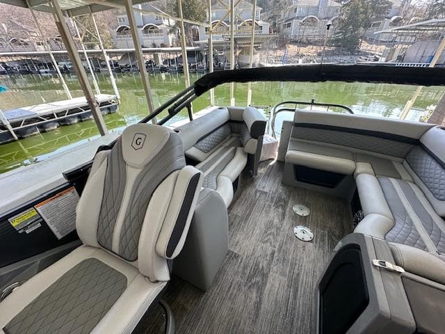Luxurious 2021 Godfrey Sanpan 2400 ULC pontoon boat interior with plush seating and elegant design.