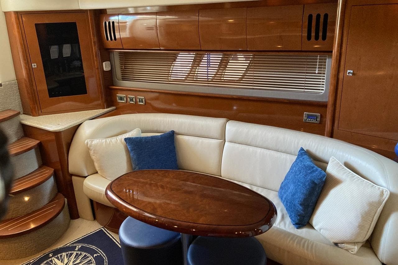 Luxurious 2008 Sea Ray 44 Sundancer yacht interior with plush seating and elegant wood finishes.