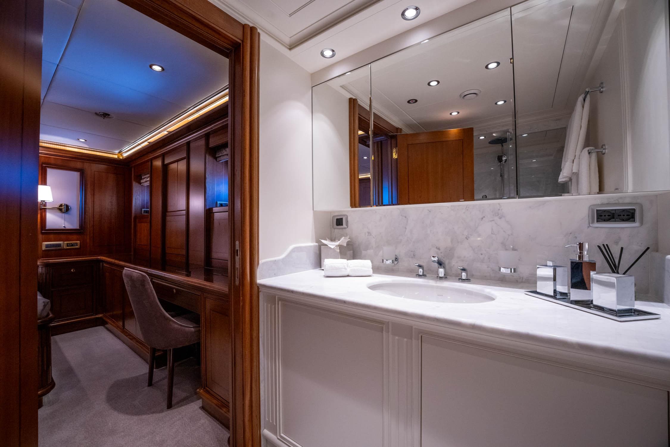 Luxurious bathroom interior on 2009 Aegean Yacht 3 Mast Schooner, featuring elegant wood and marble finishes.