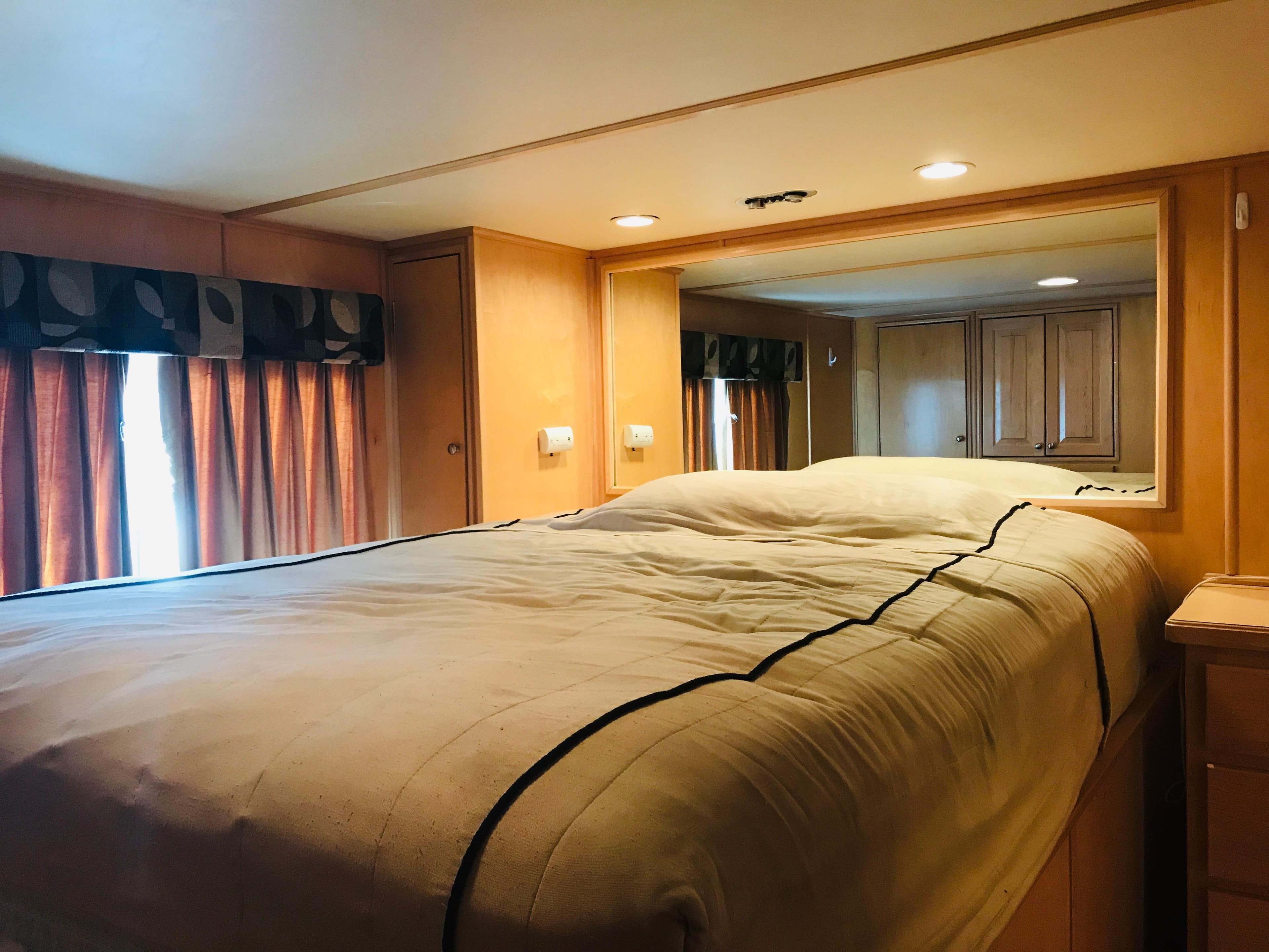 Cozy bedroom interior in 2005 Stardust Cruisers Summer Obsession houseboat.