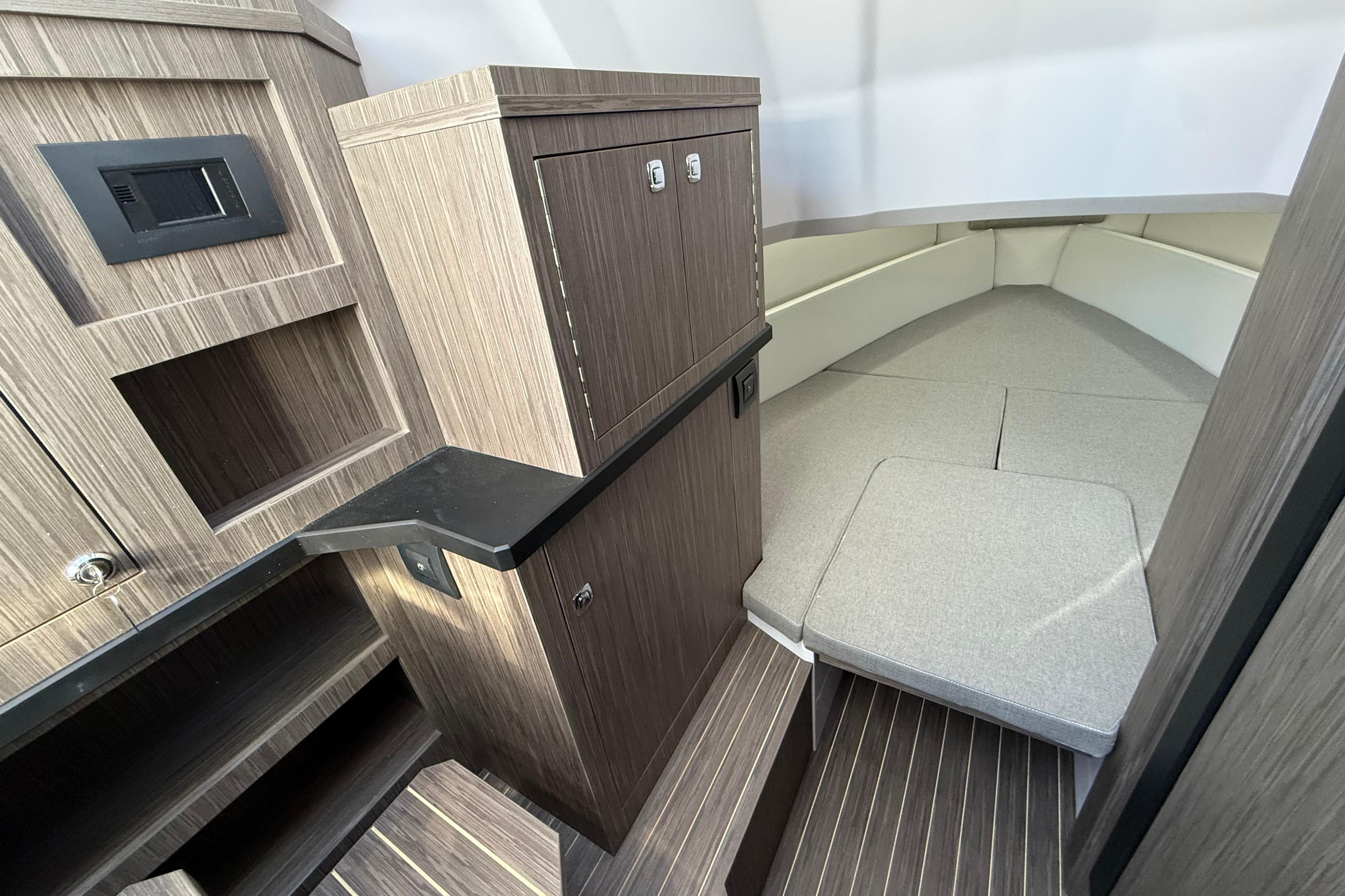Interior of 2026 Ranieri CAYMAN 38.0 EXECUTIVE, featuring modern wood cabinetry and seating.