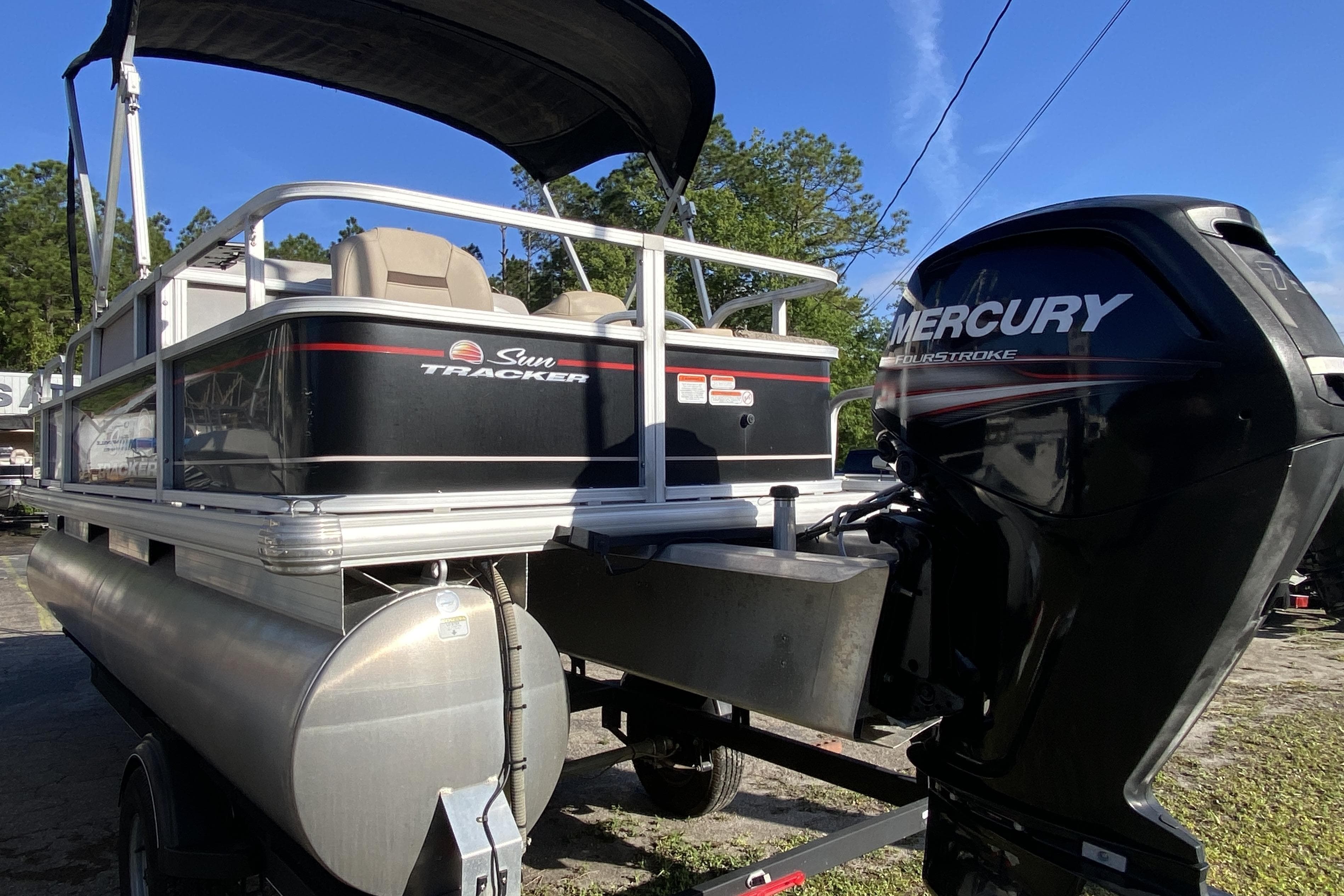 2018 Sun Tracker Bass Buggy 18 DLX pontoon boat with Mercury outboard motor.