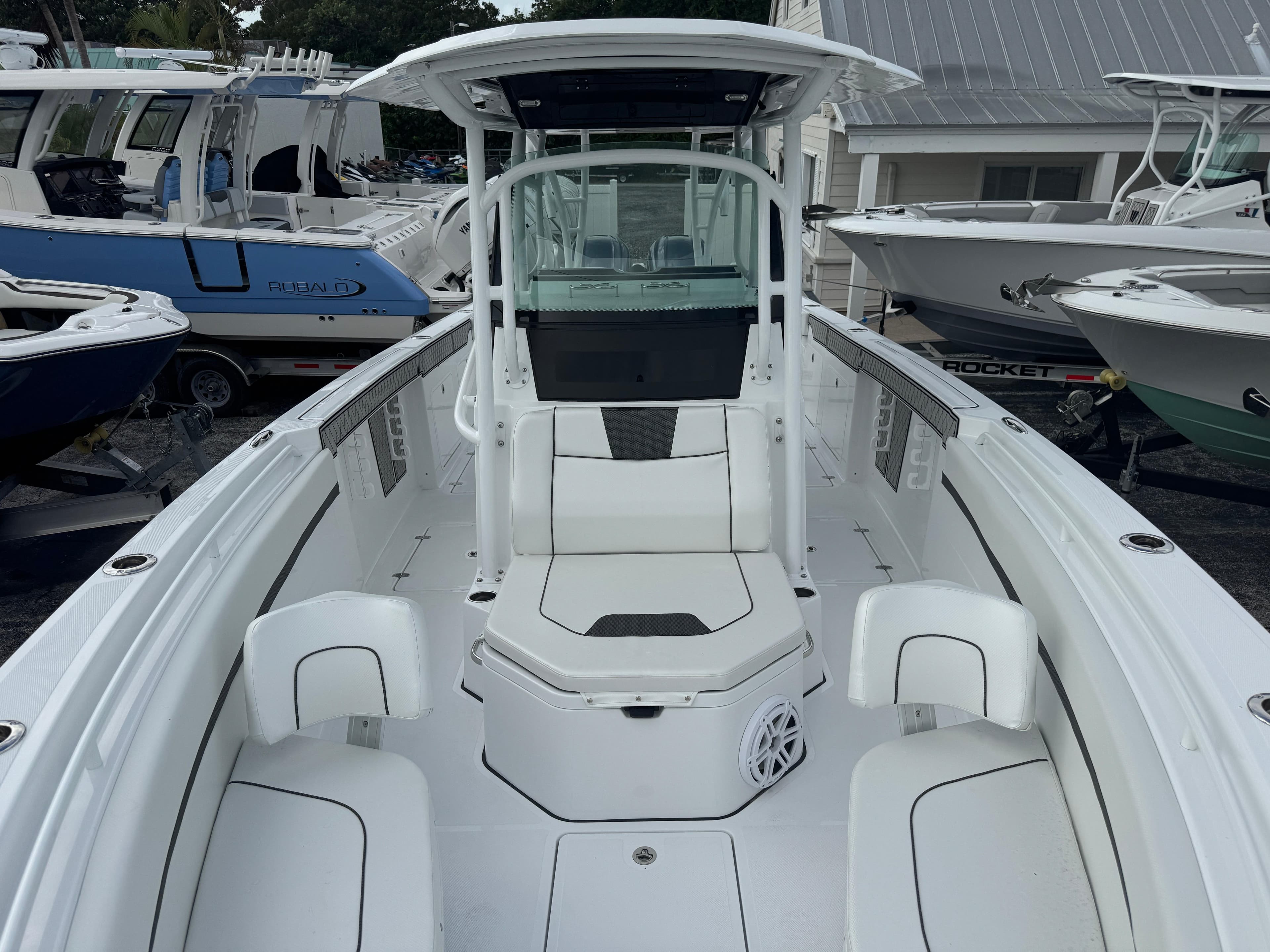2025 Wellcraft 302 Fisherman boat, sleek white design, spacious deck, modern console.