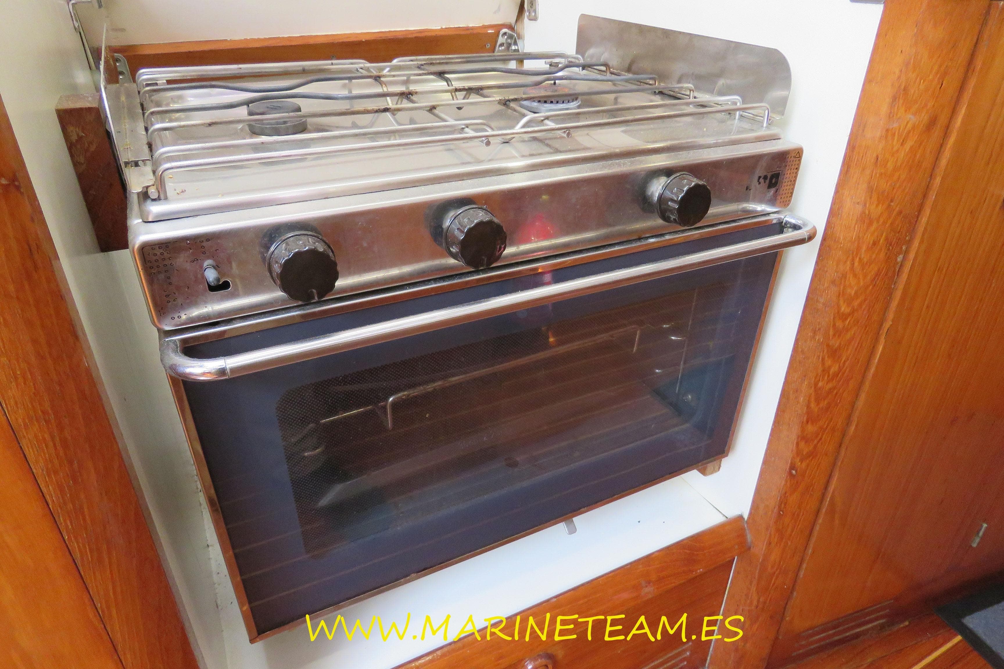 Stainless steel stove and oven in Jeanneau Sun Odyssey 45.1 yacht, 1995 model.