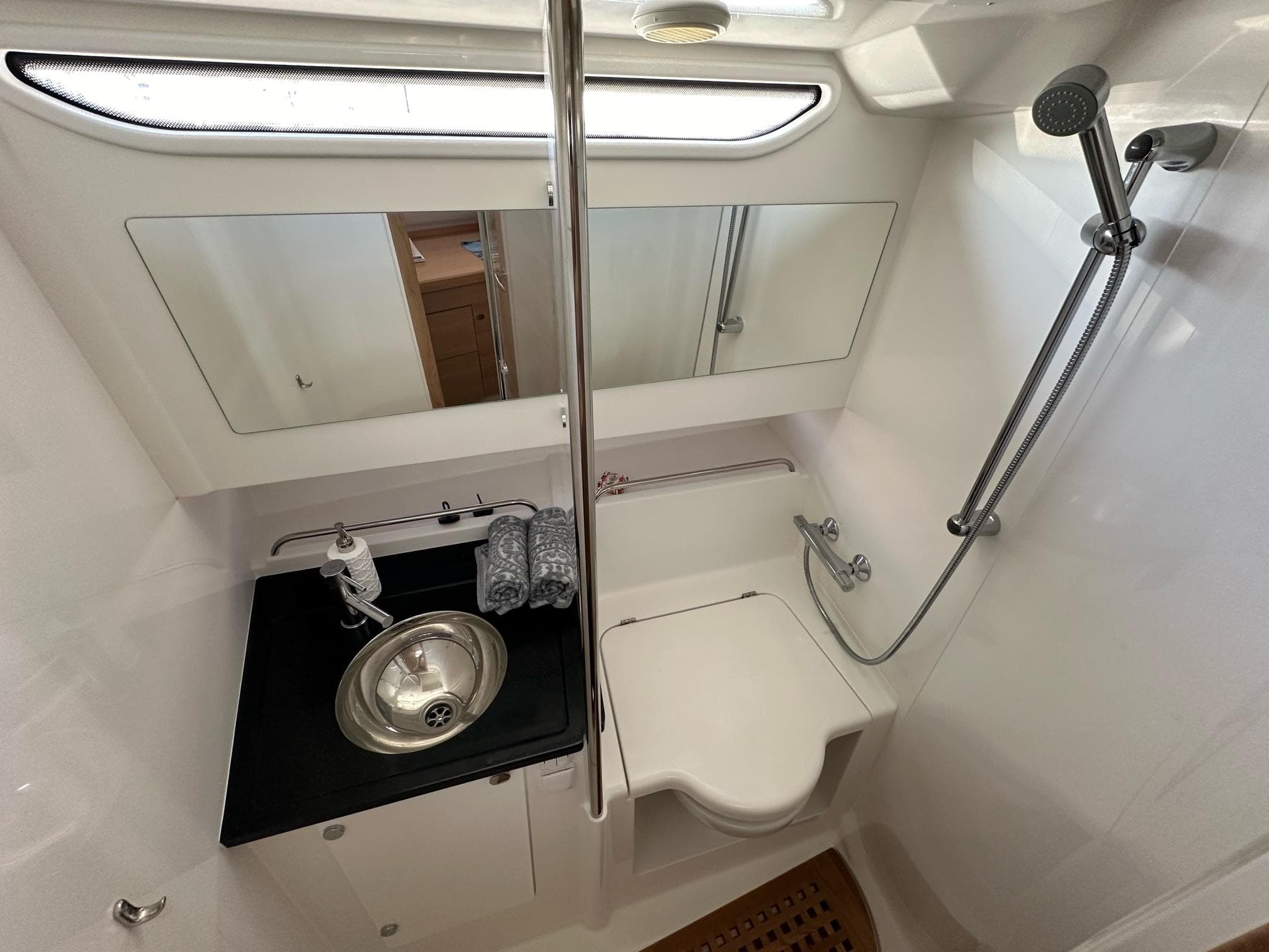 2023 Nimbus T11 bathroom with modern fixtures, stainless steel sink, and shower area.
