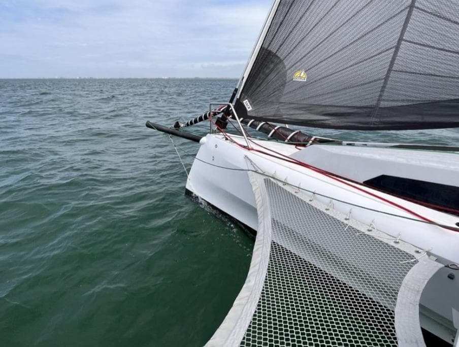 Sailing on a 2021 Corsair 880 Sport trimaran in open waters.