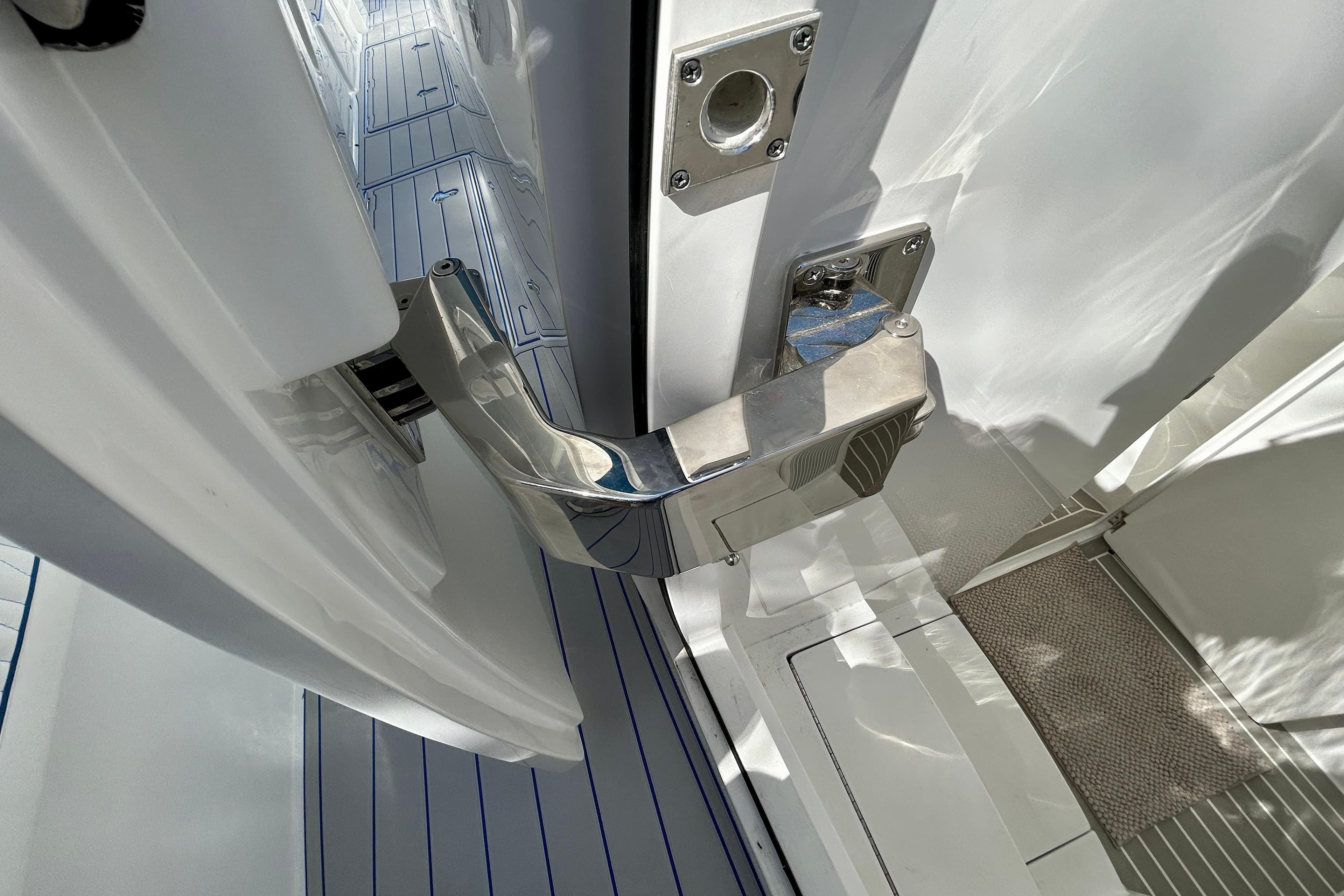 2025 Intrepid 43 Nomad SE boat door hinge detail with sleek, modern design.