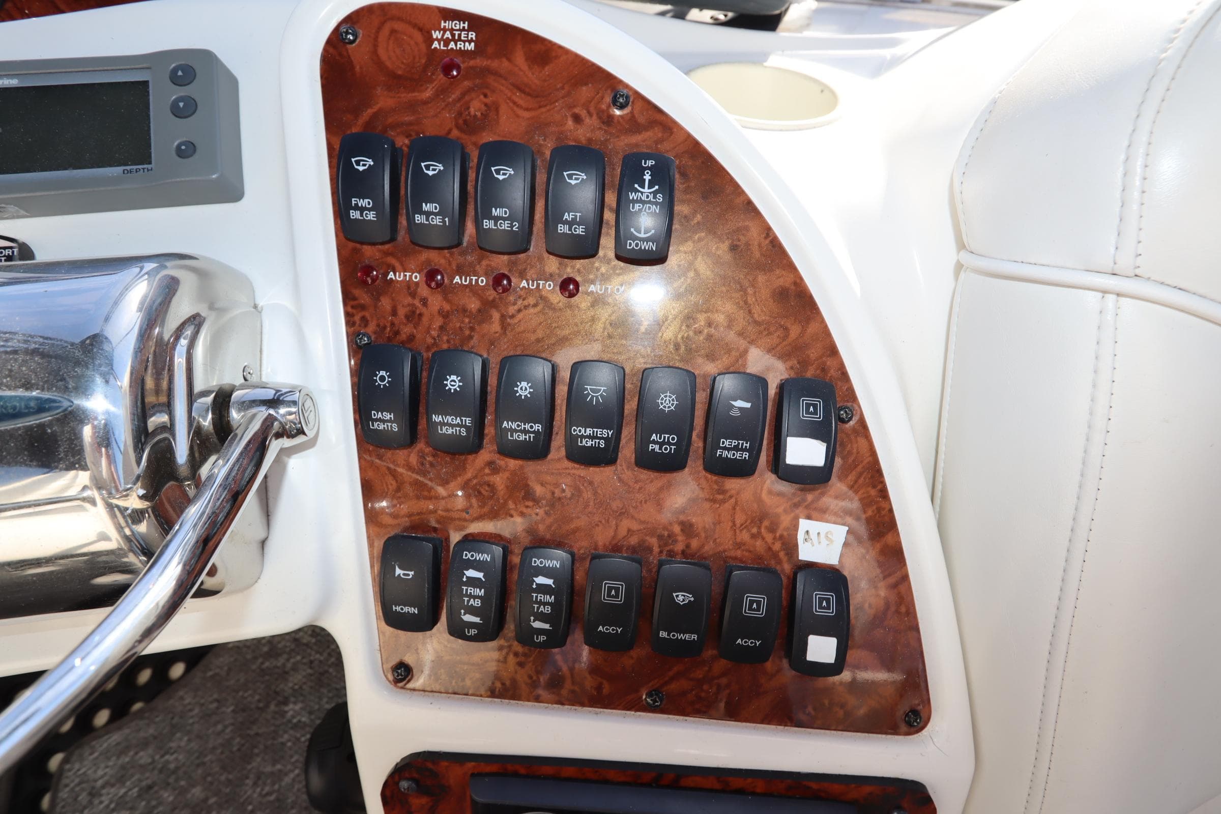 Control panel of a 2005 Meridian 459 Motoryacht with various switches and buttons.