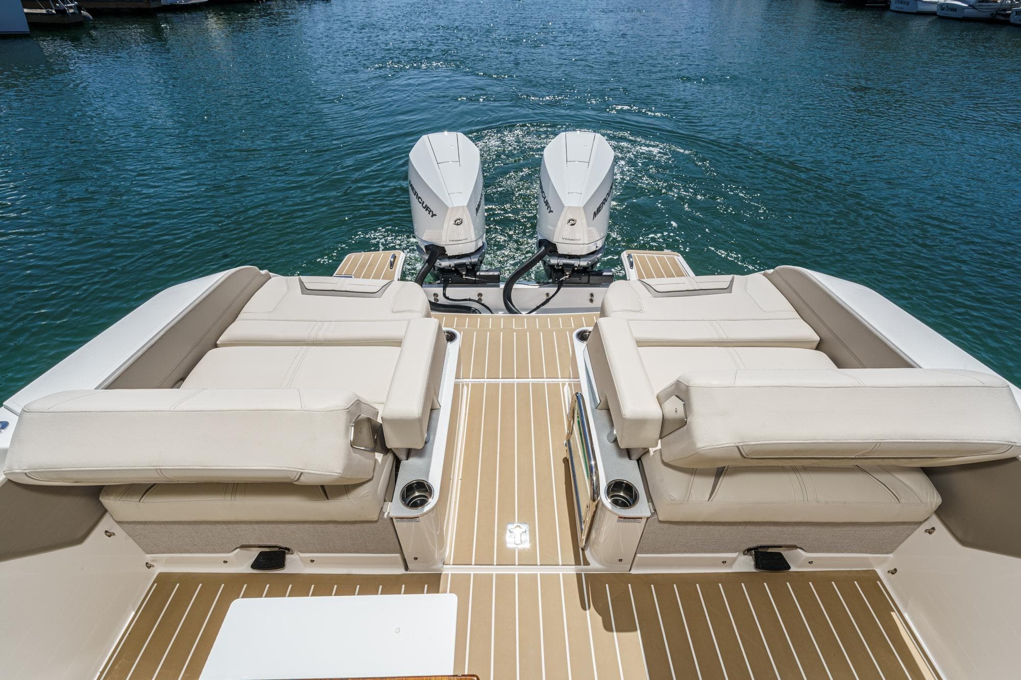 2026 Tiara Yachts 34 LX with twin outboard engines on calm water.