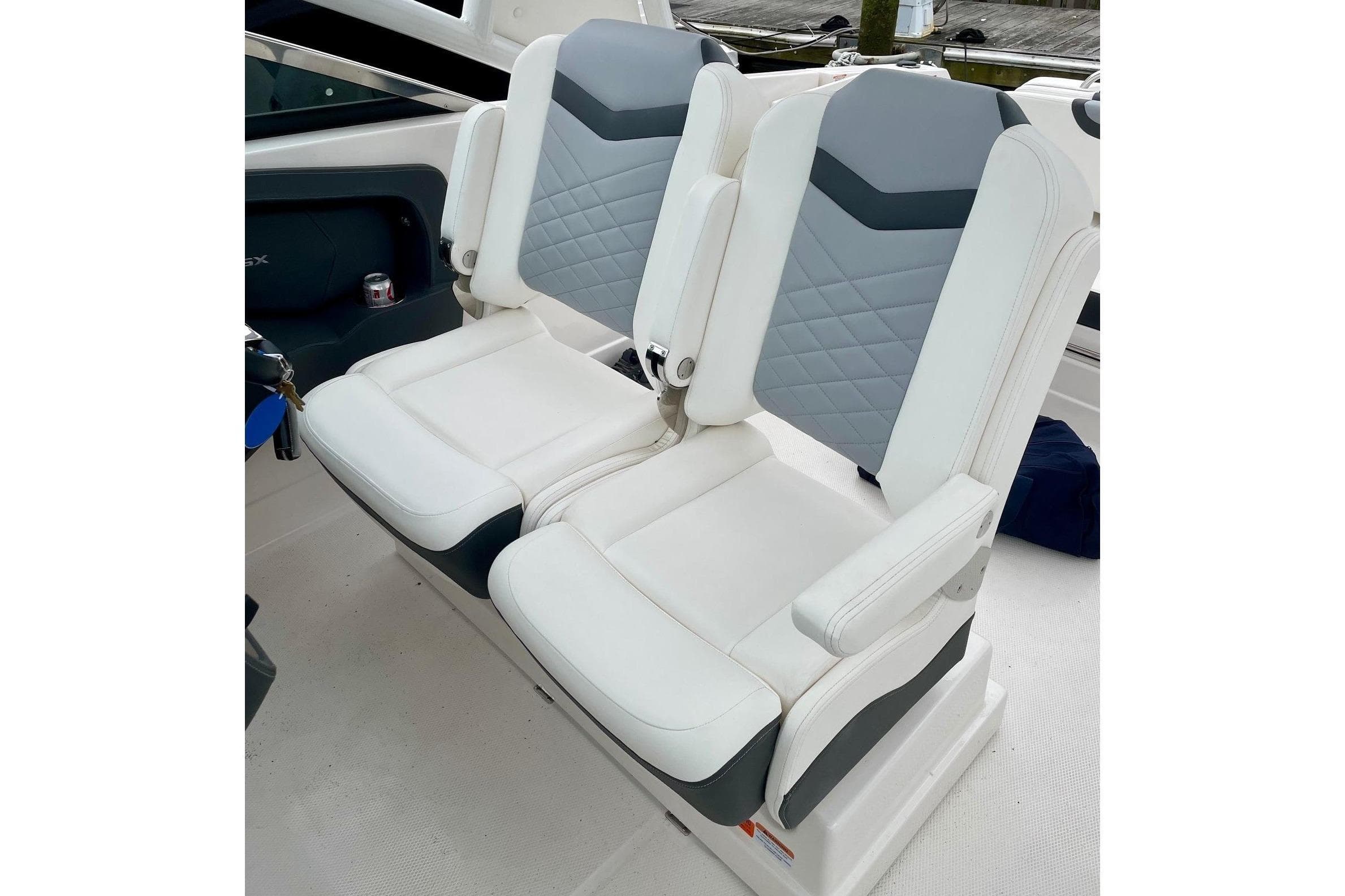2023 Chaparral 280 OSX boat interior with dual white and gray seats.