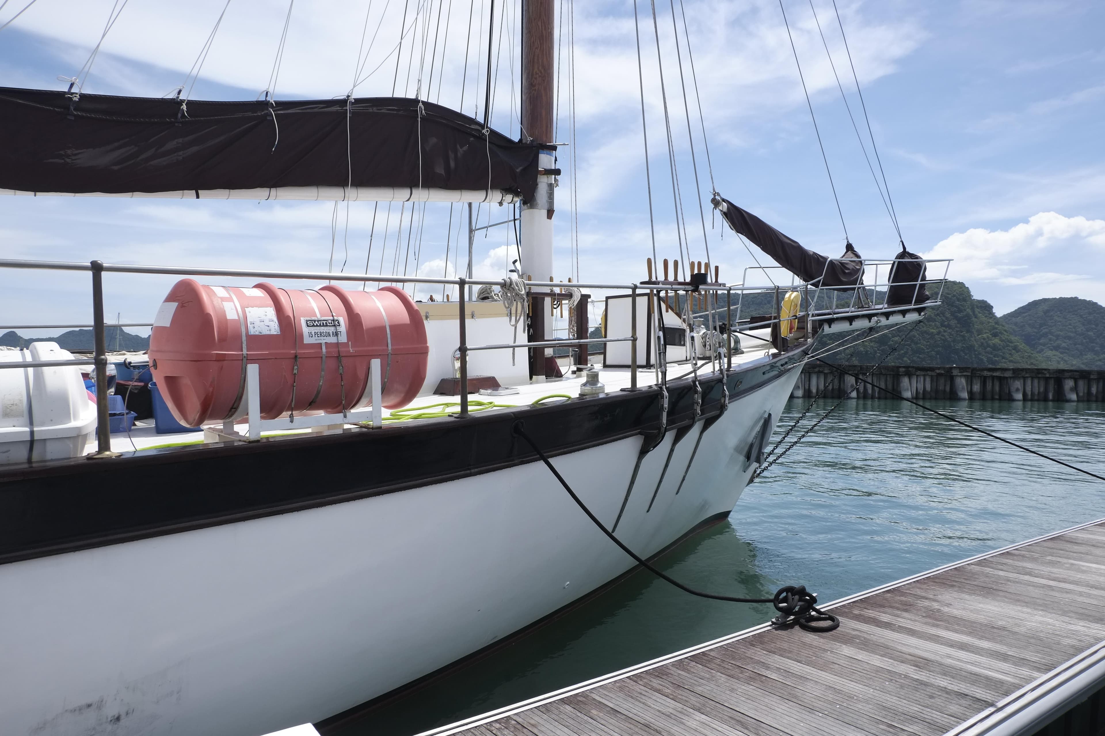 Custom Bud Macintosh schooner docked at marina, 2006 model, with clear sky and calm waters.