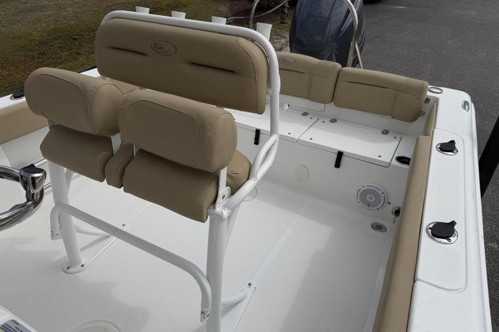 2018 Sea Hunt Ultra 225 boat interior with beige seating and white deck.