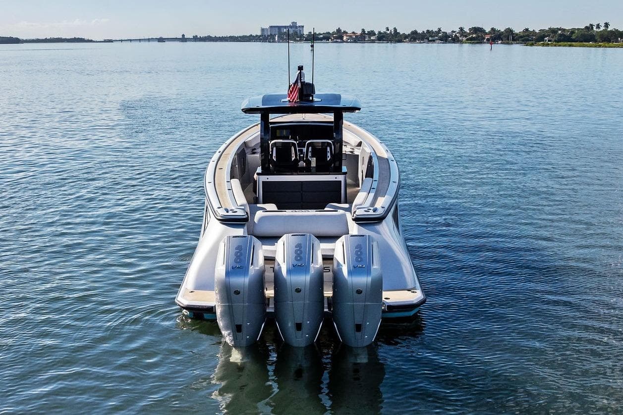 2025 Wajer 38s boat with triple outboard engines on calm water.