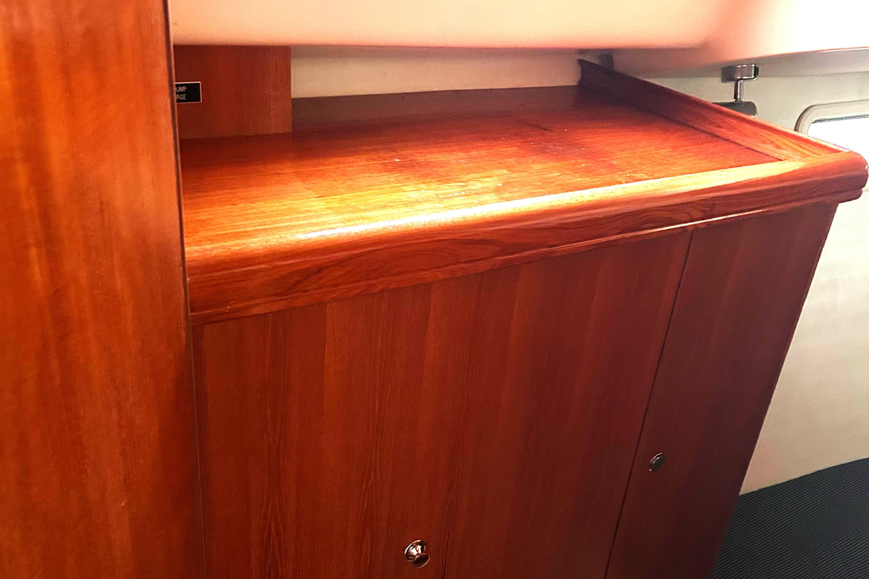 Wooden interior cabinet on a 2005 Hunter 33 sailboat.
