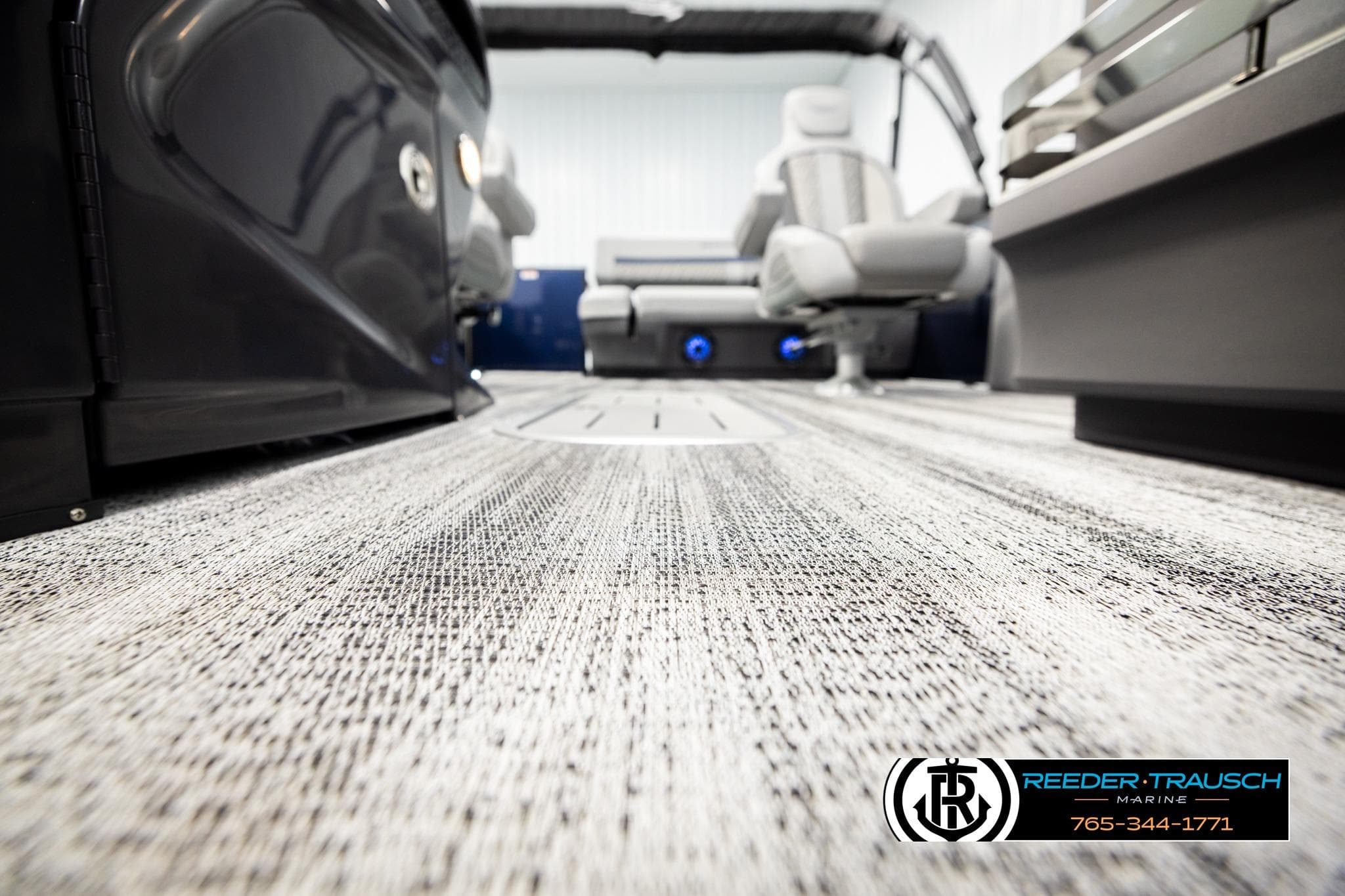 2026 Bennington 22 MSBSE boat interior with modern seating and textured flooring.