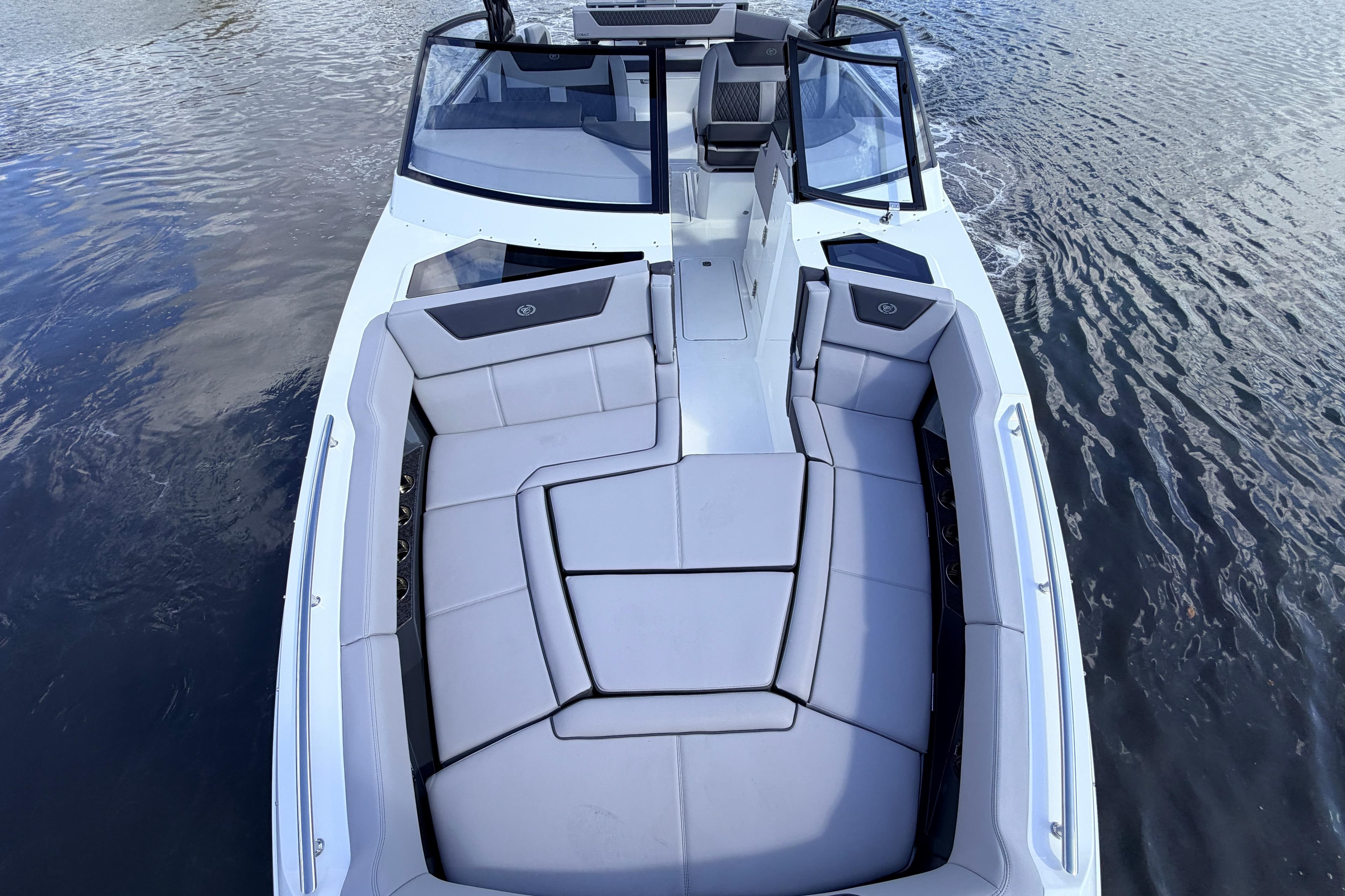 2026 Cobalt R35 Outboard boat with spacious seating on calm water.
