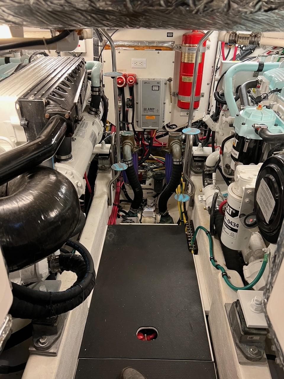 Engine room of 2005 Tiara Yachts 4200 Open, showcasing mechanical components and systems.