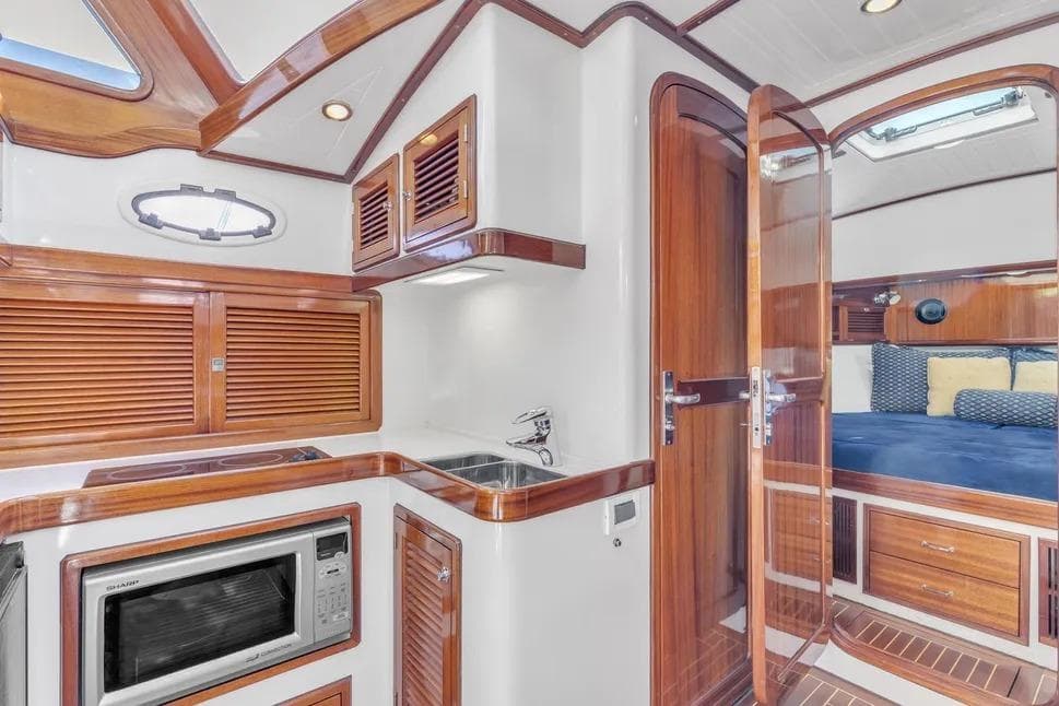 Interior of 2007 Gorbon Custom Downeast 40 yacht with wood finishes and modern amenities.