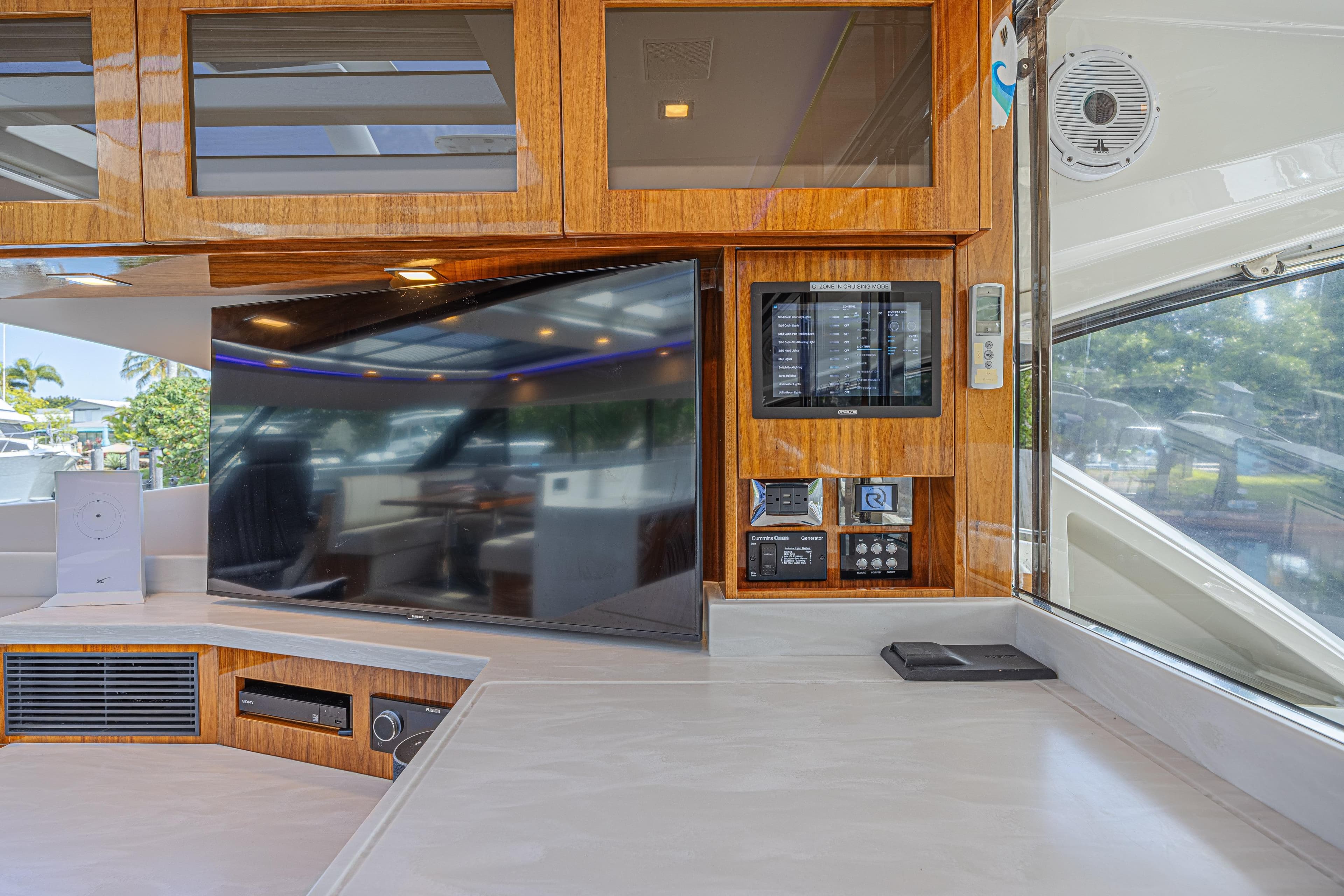 Luxurious interior of 2021 Riviera 6000 Sport Yacht Platinum Edition with modern entertainment system.