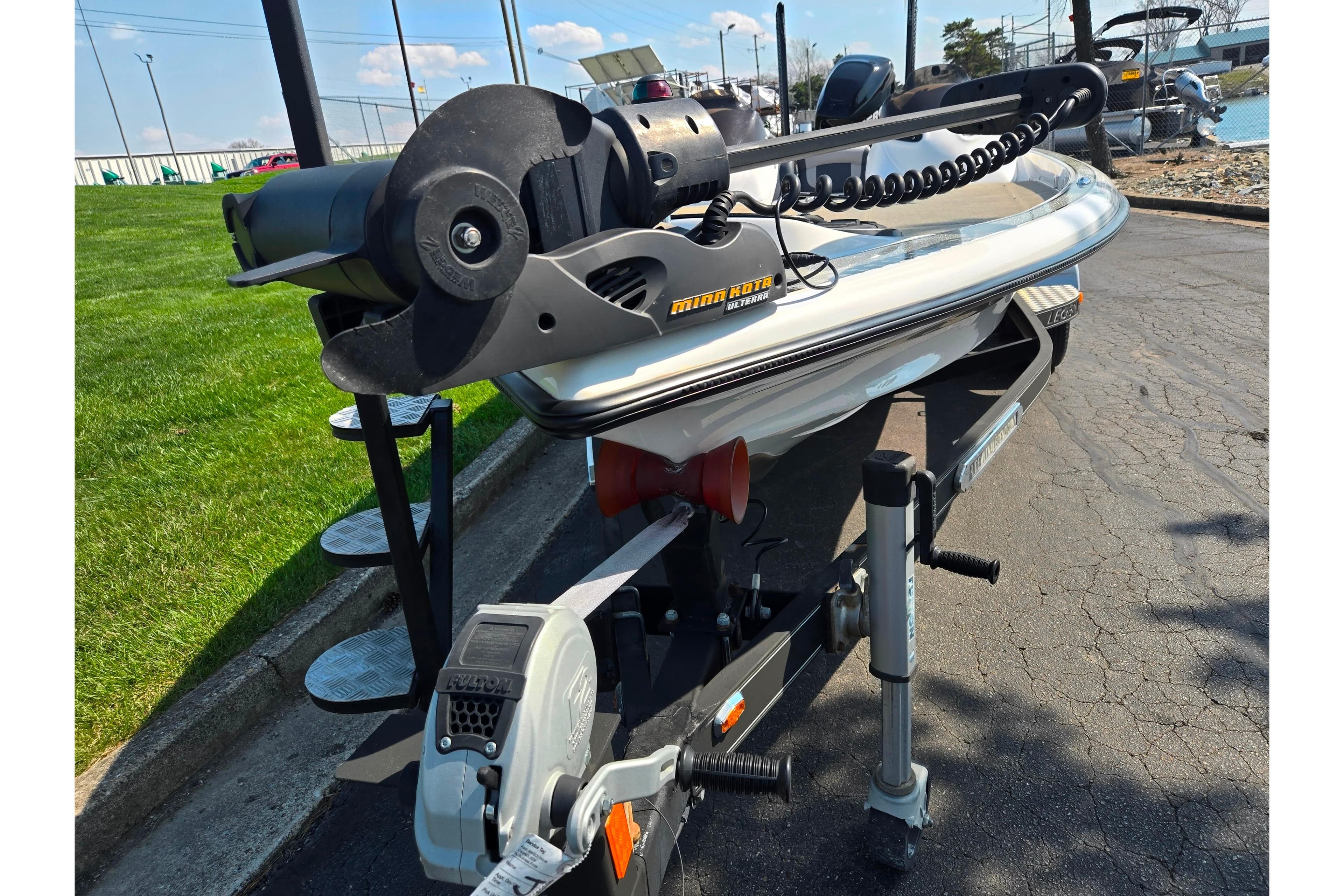 2016 Legend Alpha 211R DC boat on trailer with Minn Kota trolling motor.