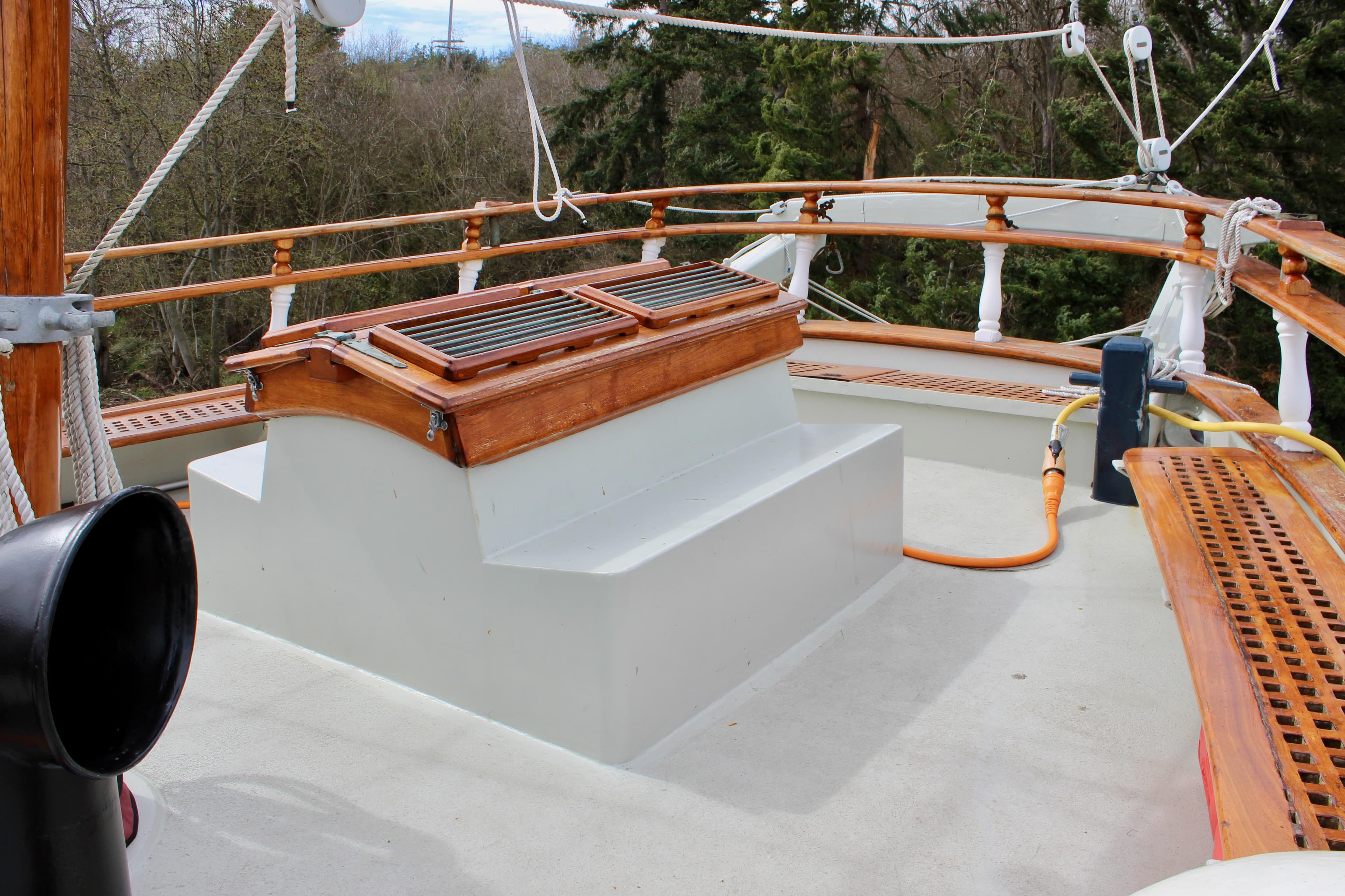 Deck of 1988 Custom Lahaina Welding Co. Square Topsail Ketch with wooden details and rigging.