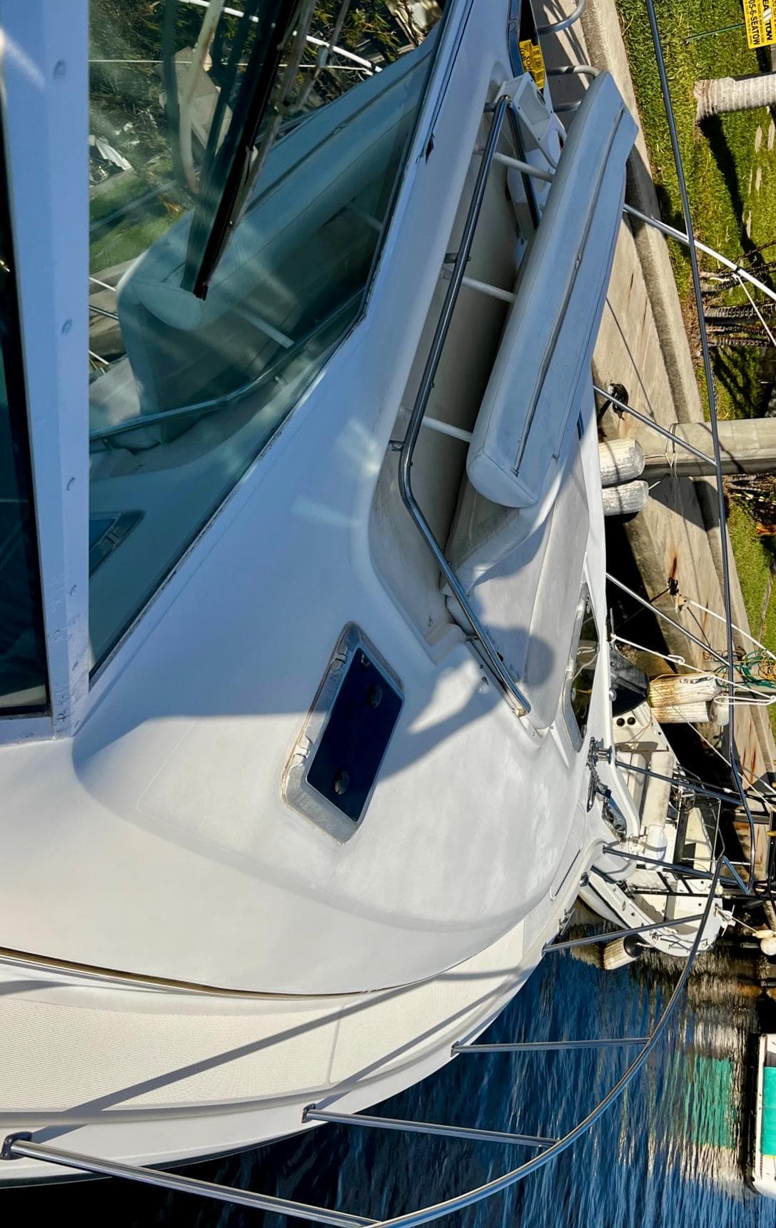 1996 Tiara Yachts 3500 Express docked at a marina.