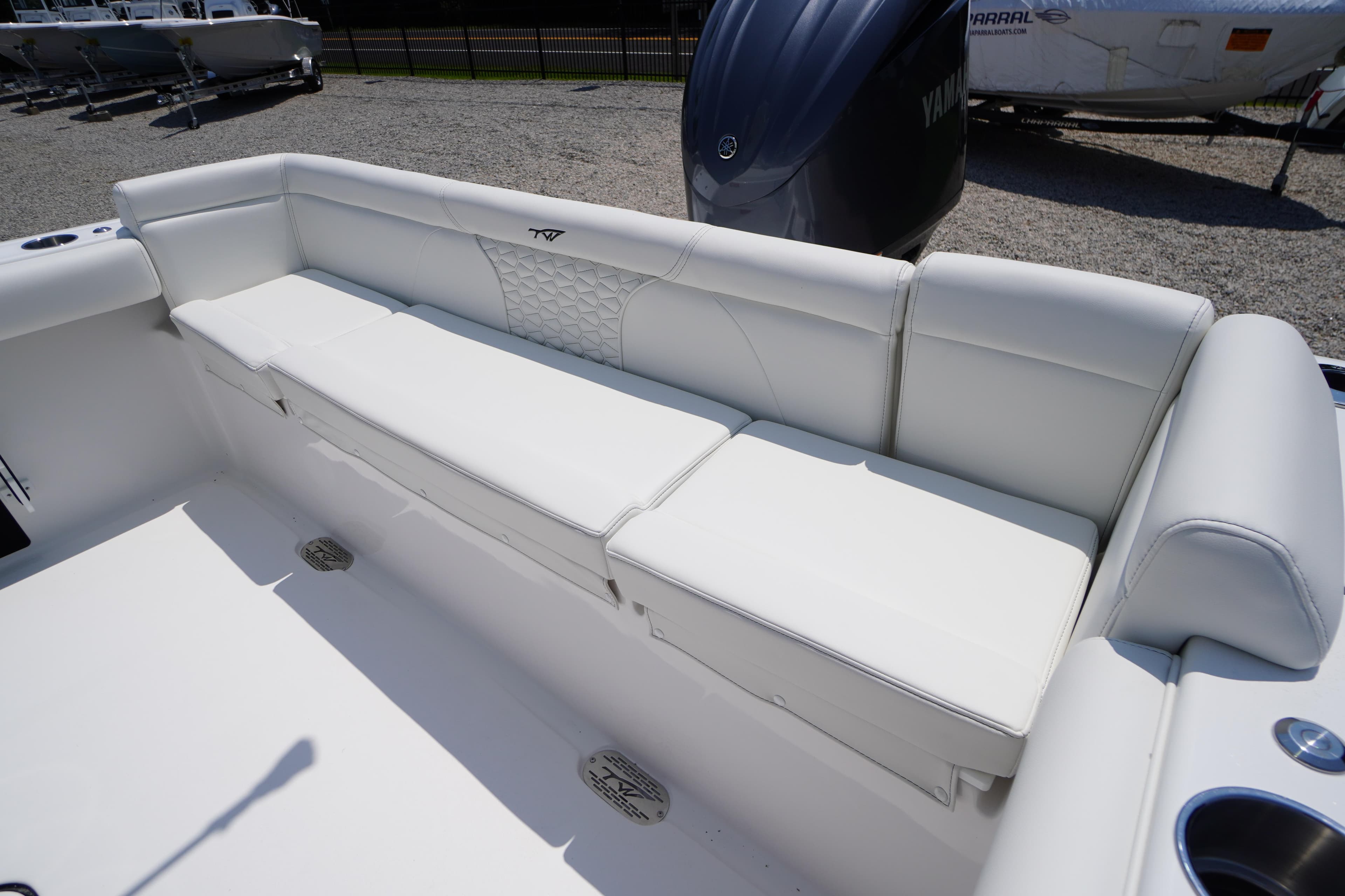 2026 Tidewater 232 LXF boat with white cushioned seating and Yamaha engine.