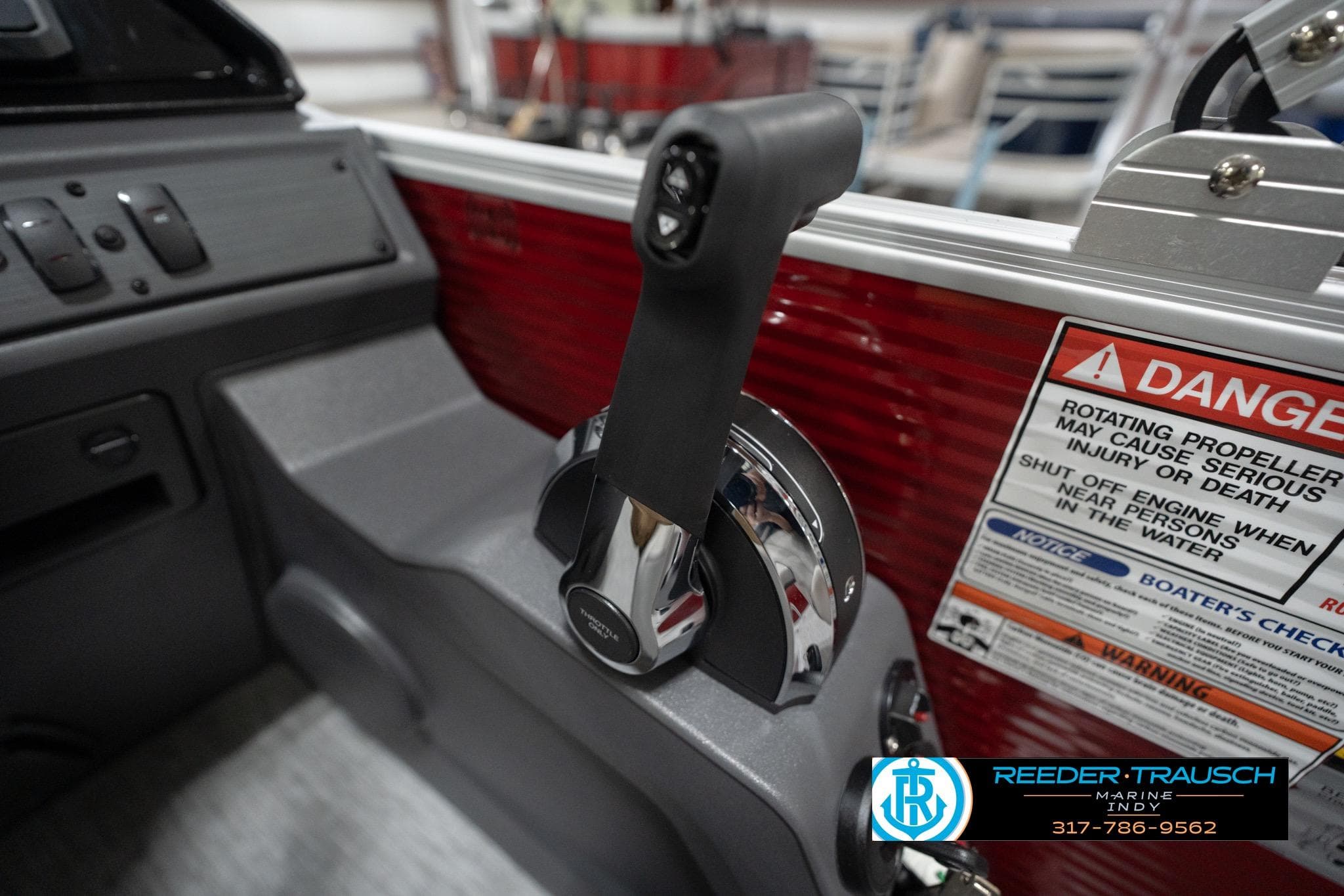 Control panel of 2026 Bennington 20 SL boat with safety warning labels.