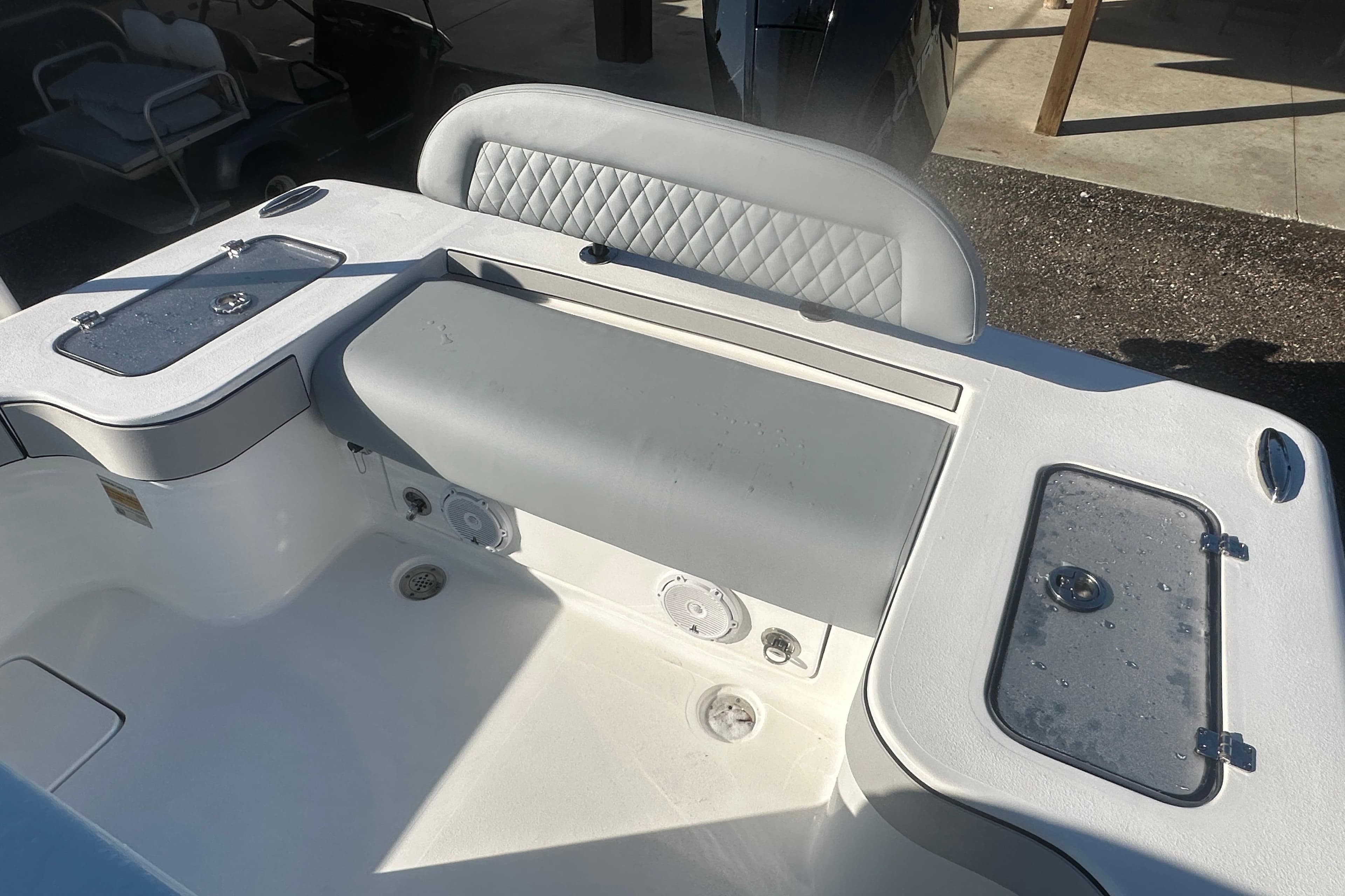 2026 Delta Boatworks Delta D245 interior with cushioned seating and storage compartments.