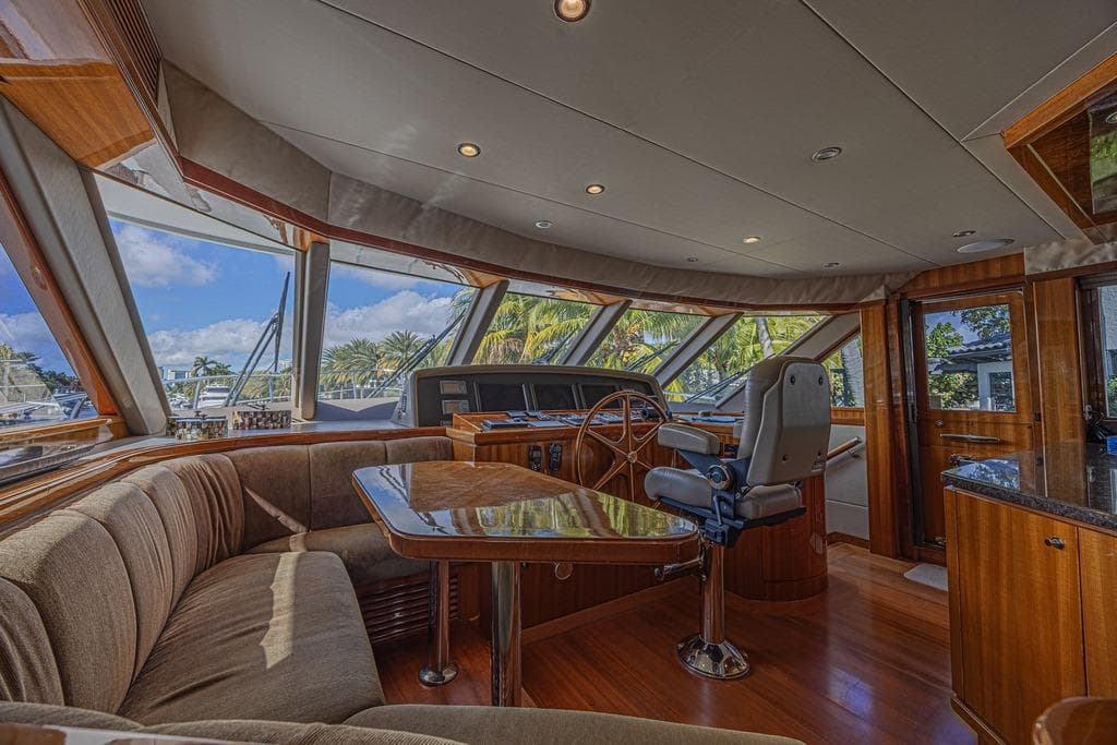 Luxurious interior of 2010 Ocean Alexander 74 Motoryacht with panoramic windows and elegant seating.