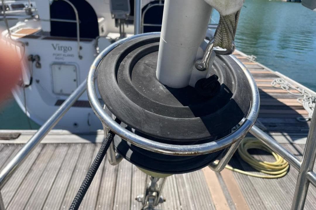 Close-up of a 1981 Corbin 39 sailboat's deck and rigging at a marina.