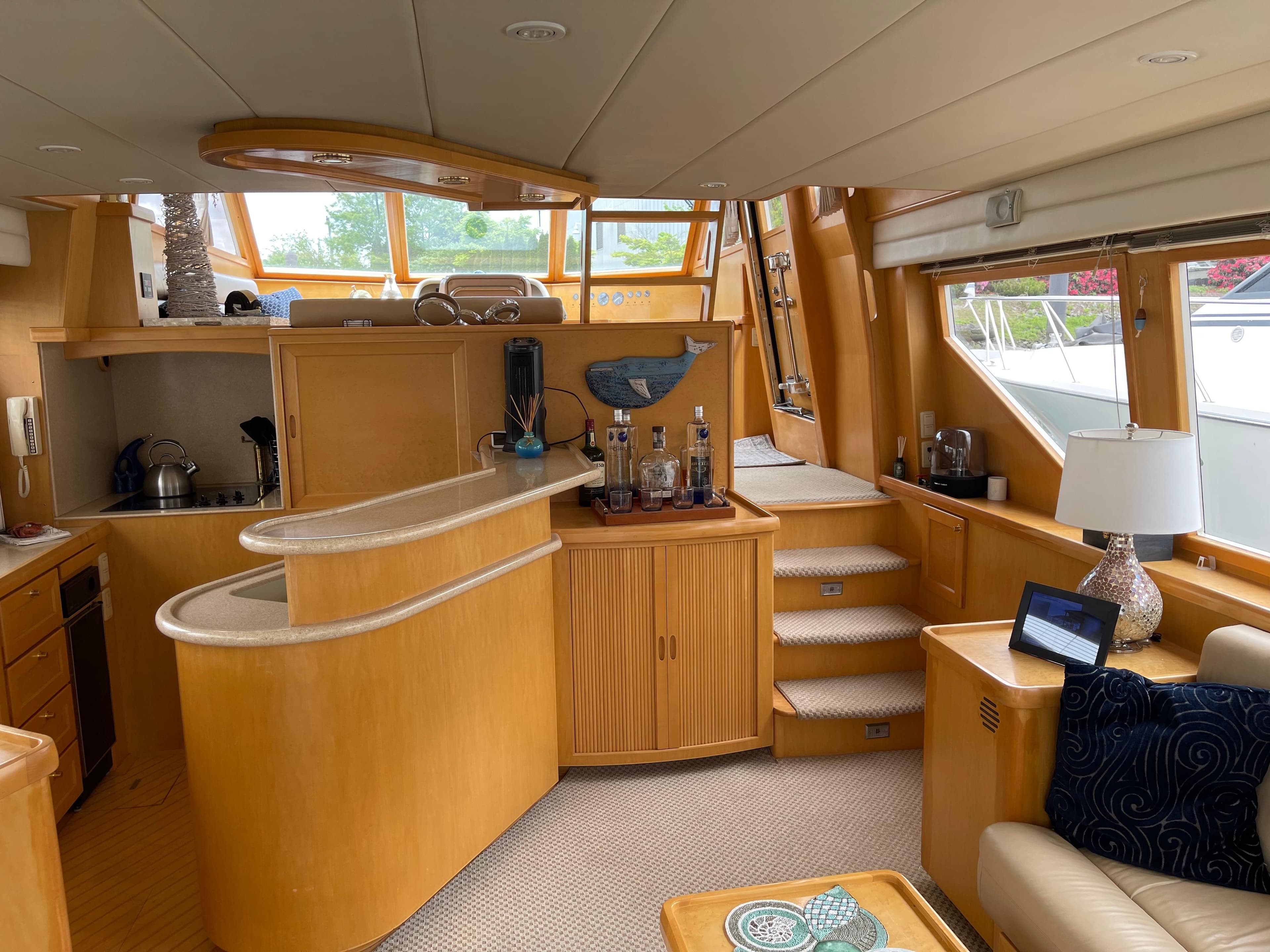 Luxurious interior of a 2000 McKinna 57 Pilothouse yacht with modern amenities.