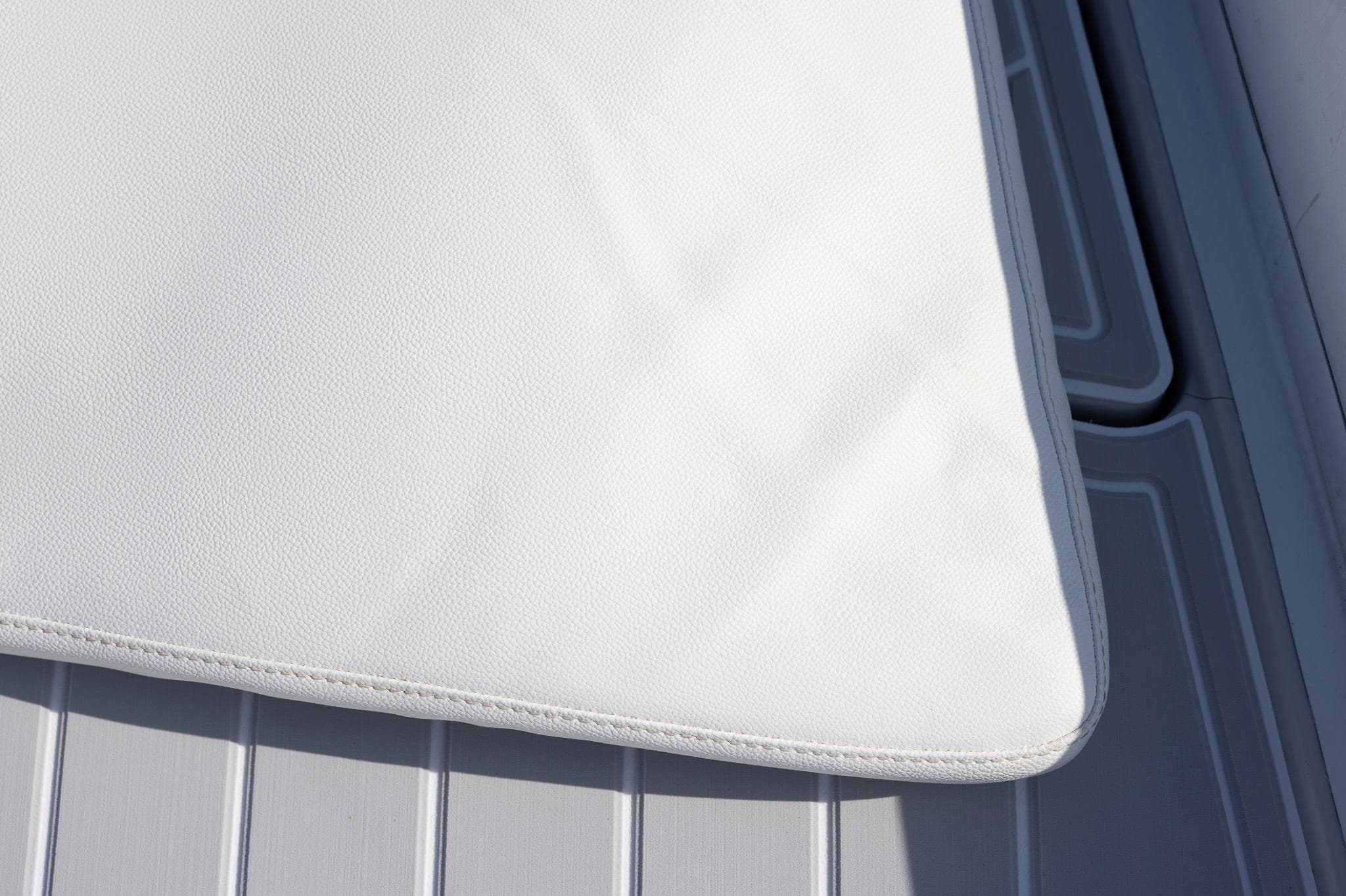 White cushion on a Zeta Elle 34 Custom boat deck, 2013 model.